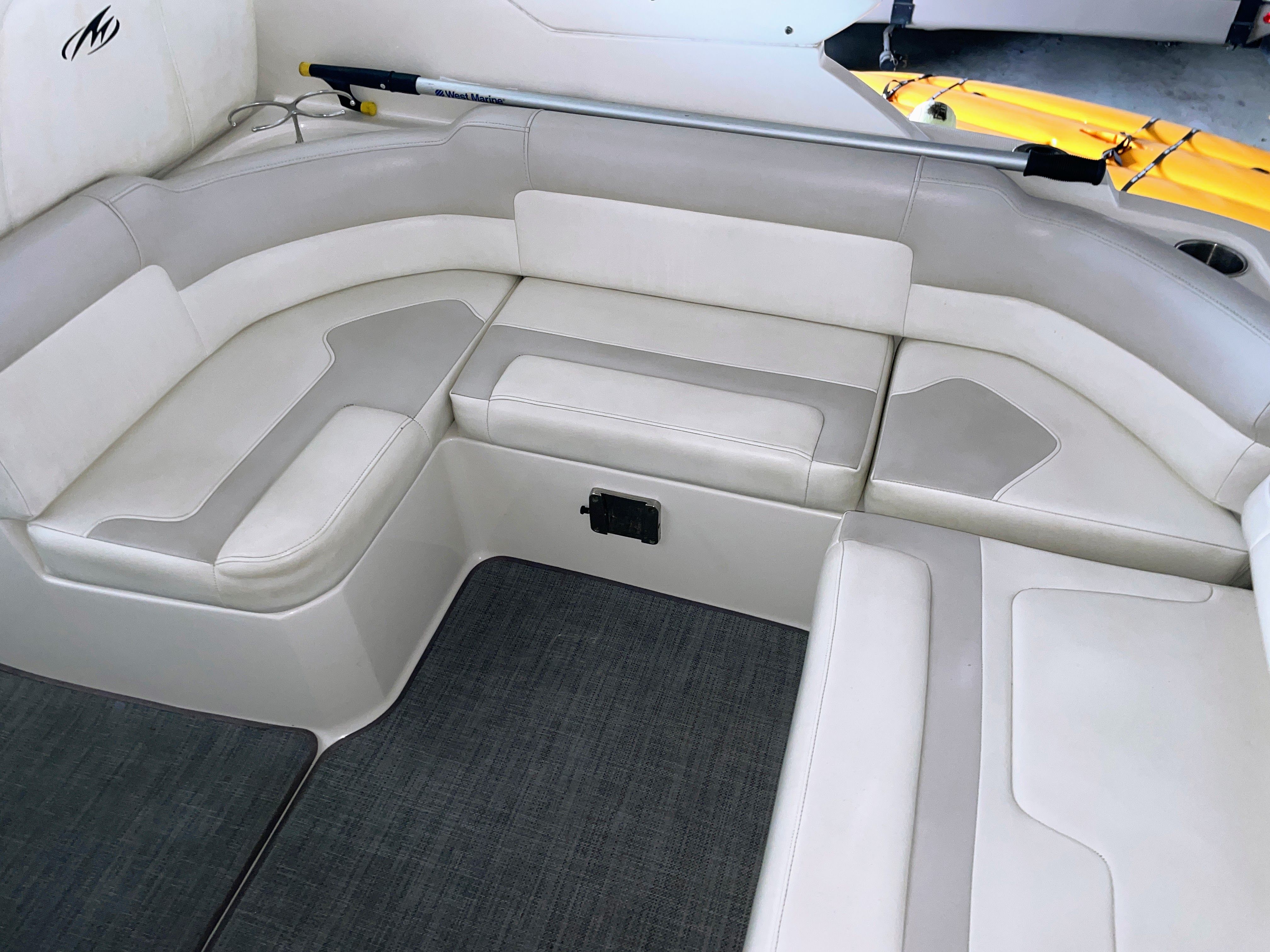 Interior of a 2010 Monterey 280 Sport Cruiser with white seating.