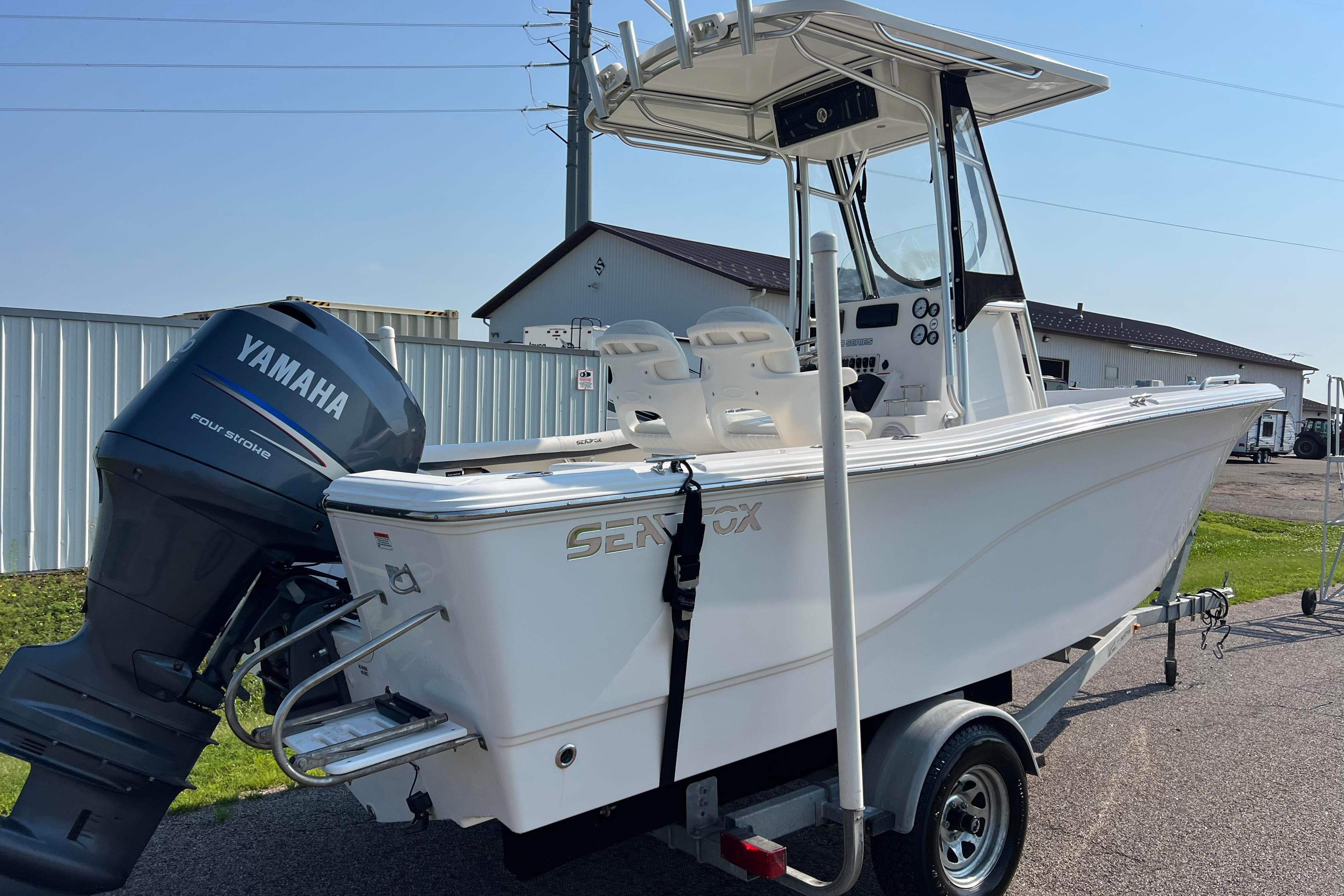 2012 Sea Fox 206 Center Console boat with Yamaha engine on trailer.