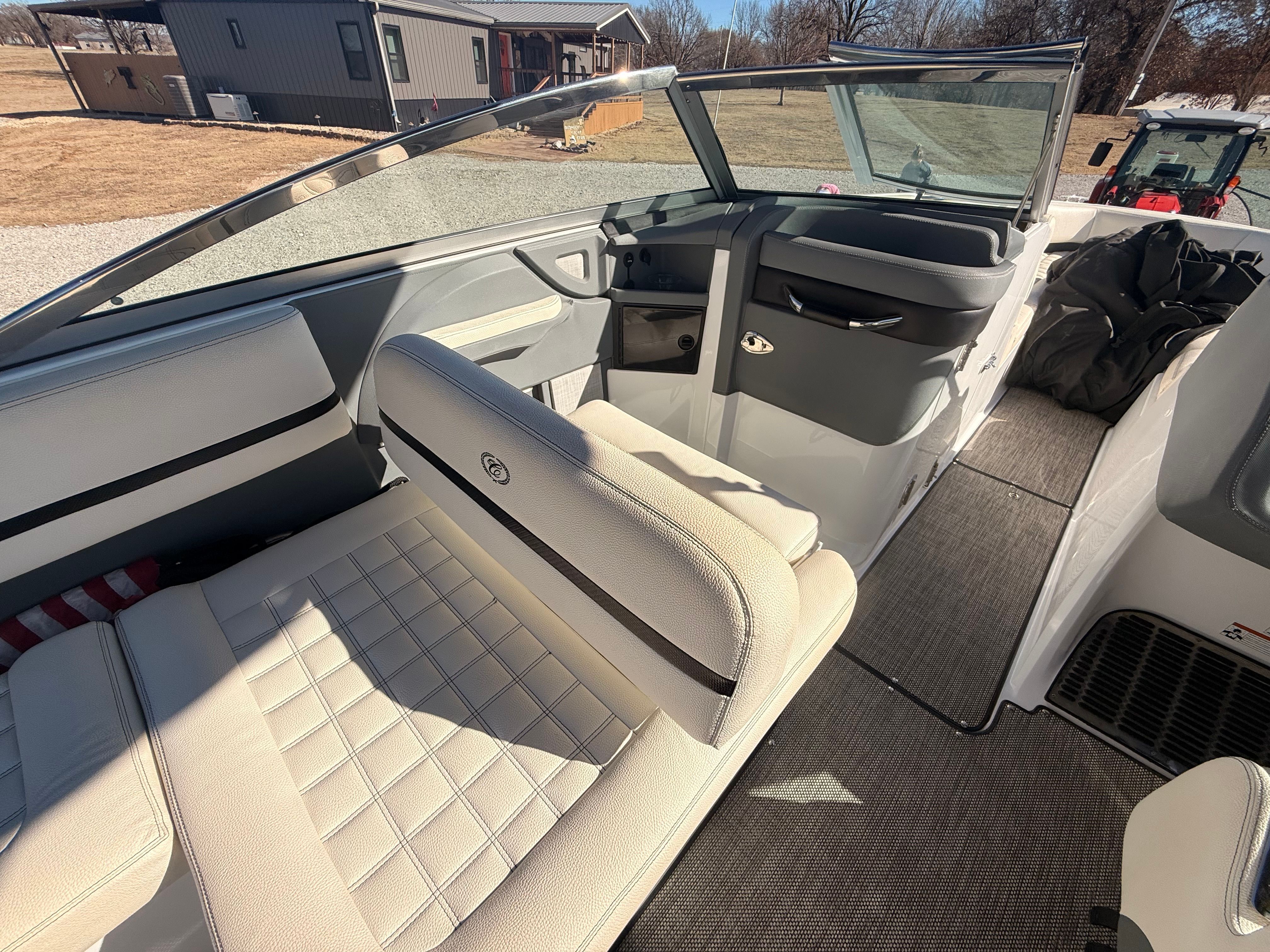The image shows the interior of a 2019 Cobalt R7 Surf boat with beige seating.