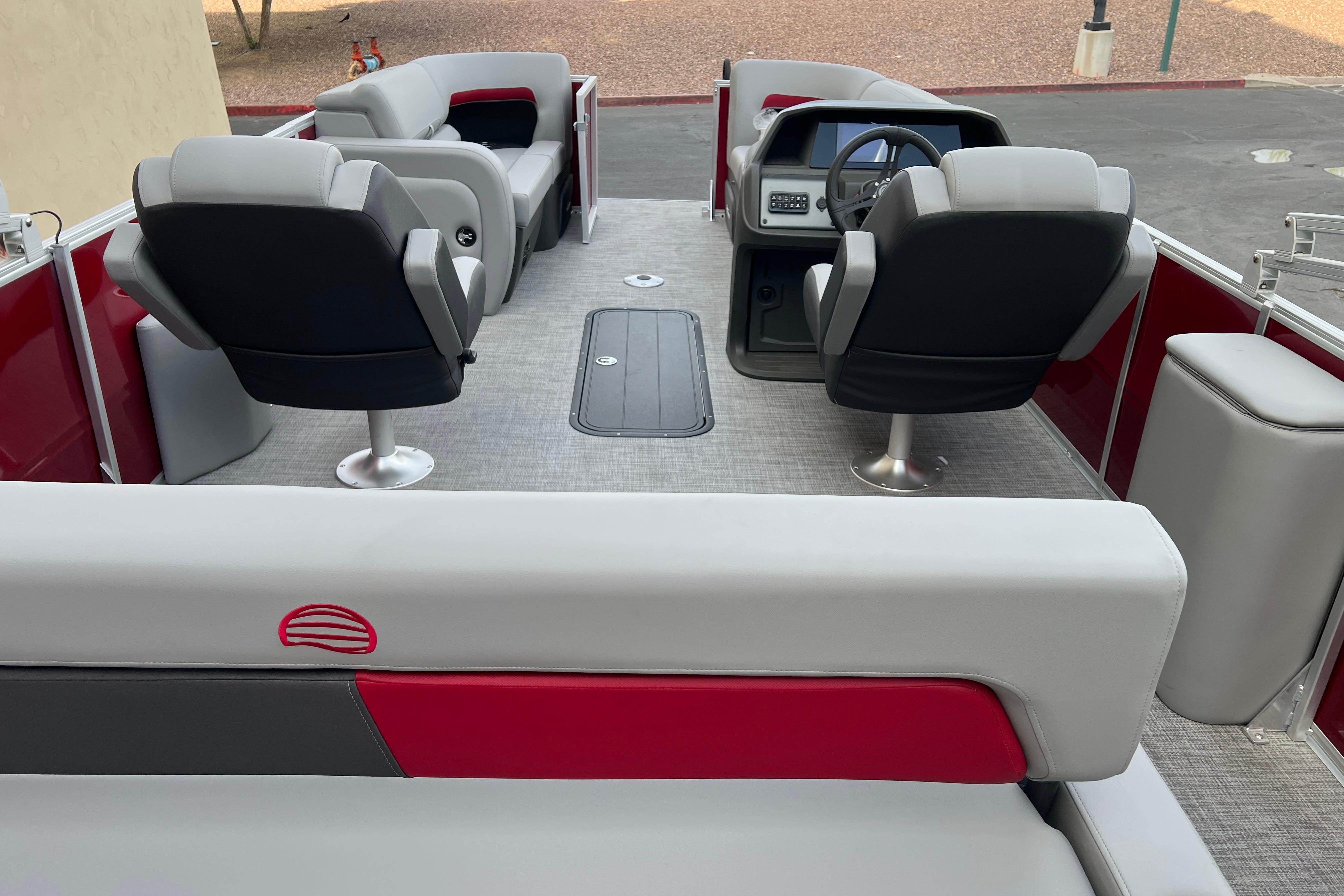 2026 Sun Tracker Party Barge 22 RF XP3 interior with modern seating and steering console.