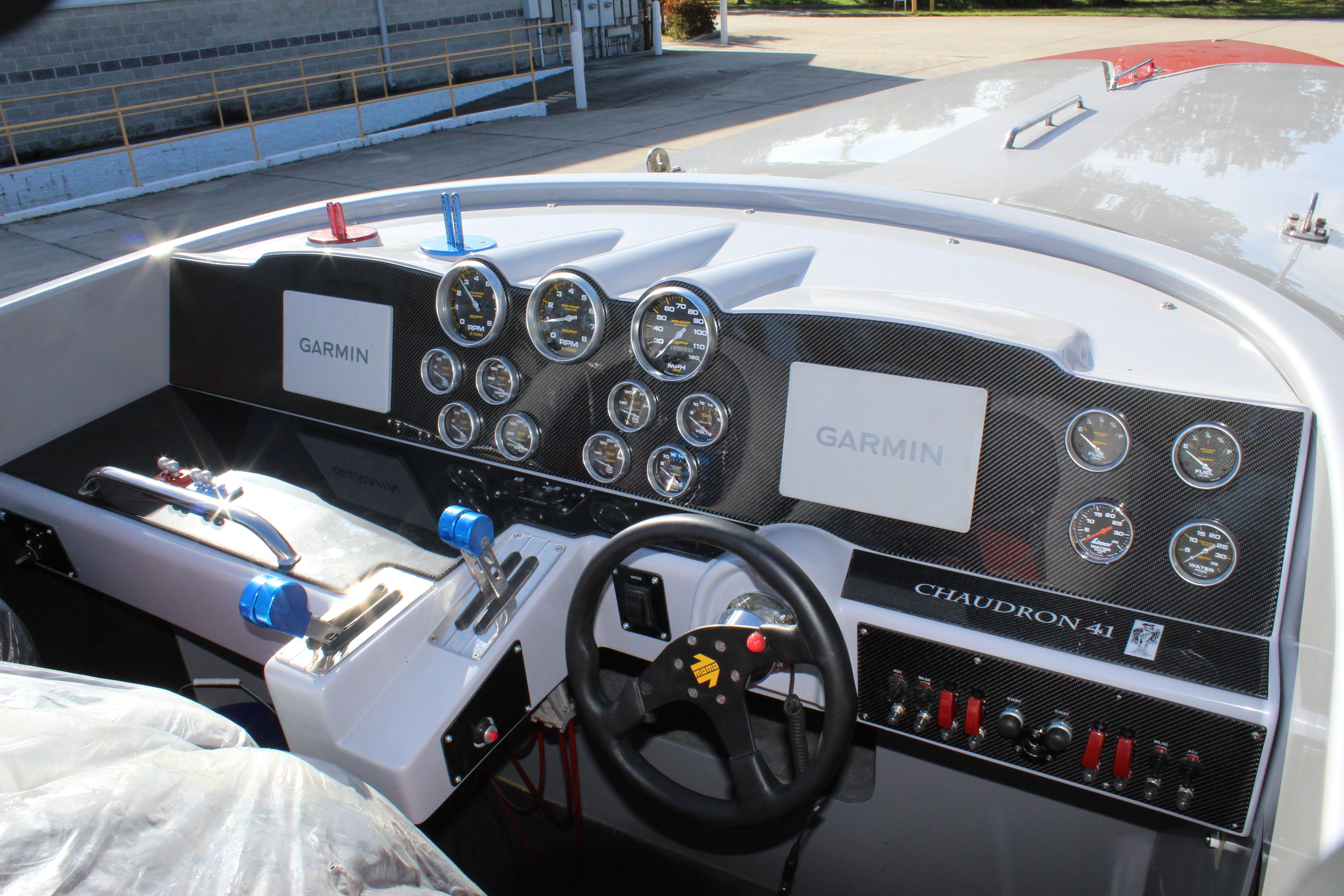 Dashboard of 2007 Chaudron 41 SS boat with Garmin displays and multiple gauges.