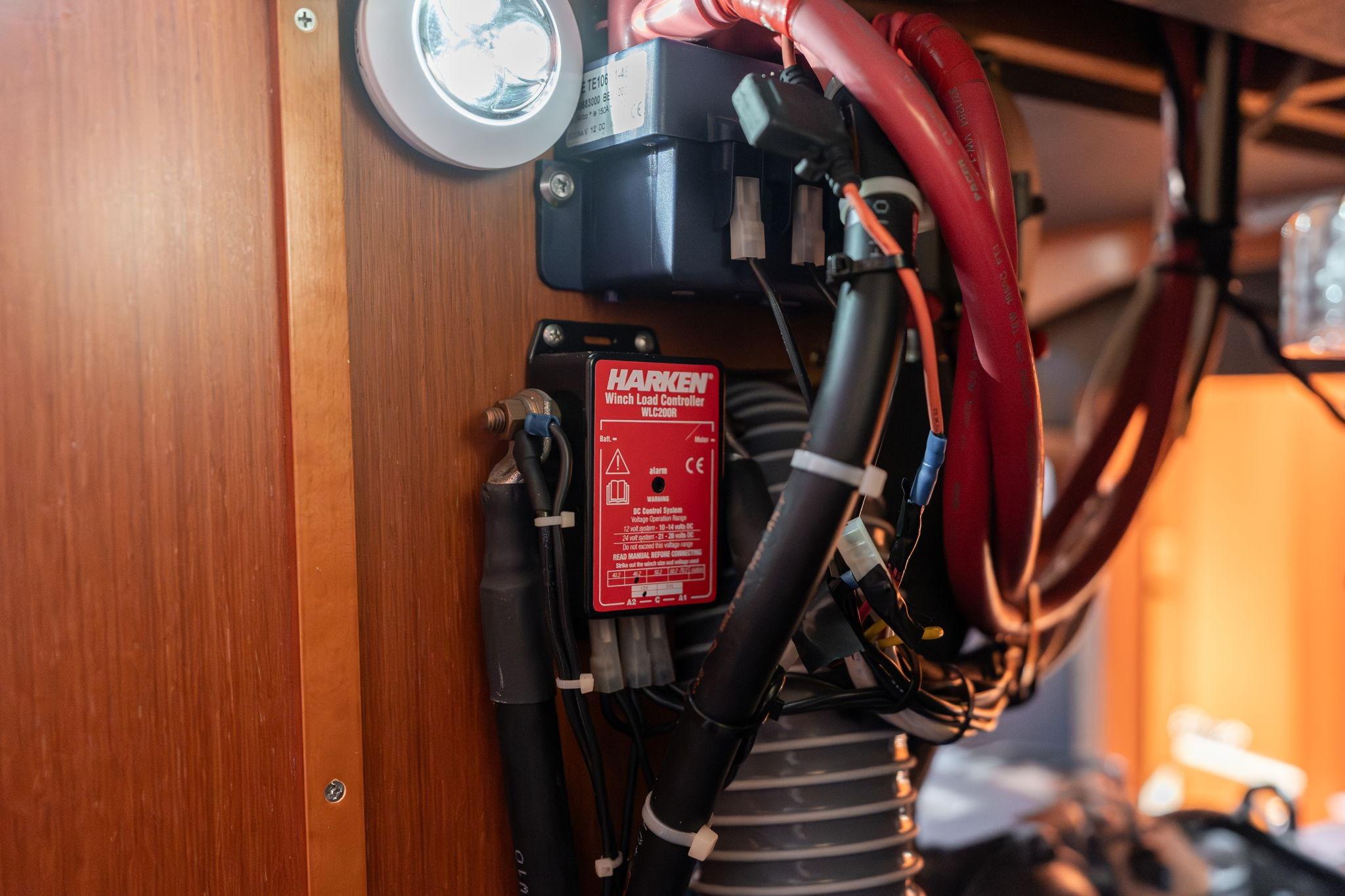 Electrical components inside a 2013 Beneteau Oceanis 50 yacht, featuring Harken winch load controller.