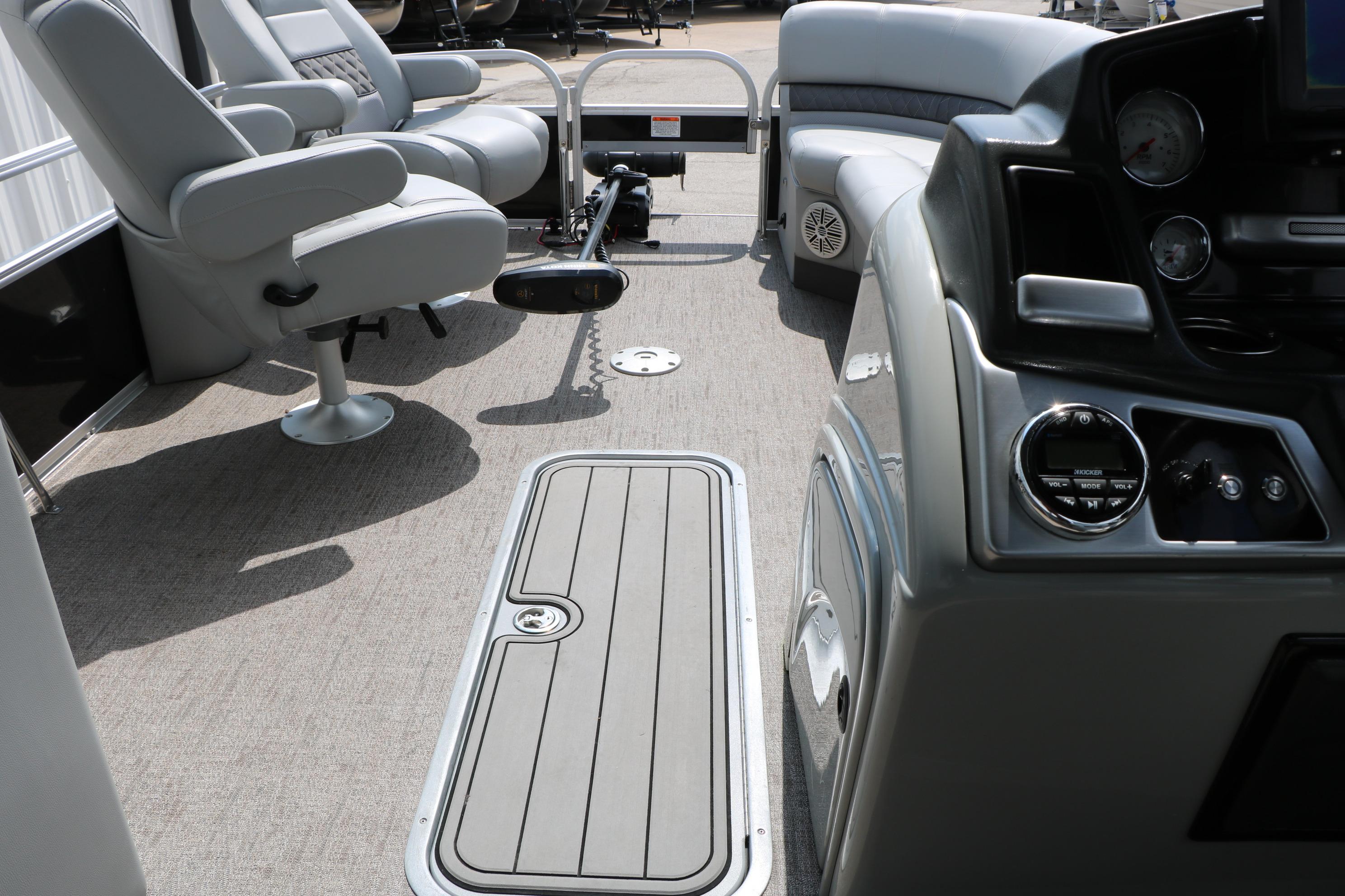 Interior of 2021 Ranger 223FC boat with seating and control panel.
