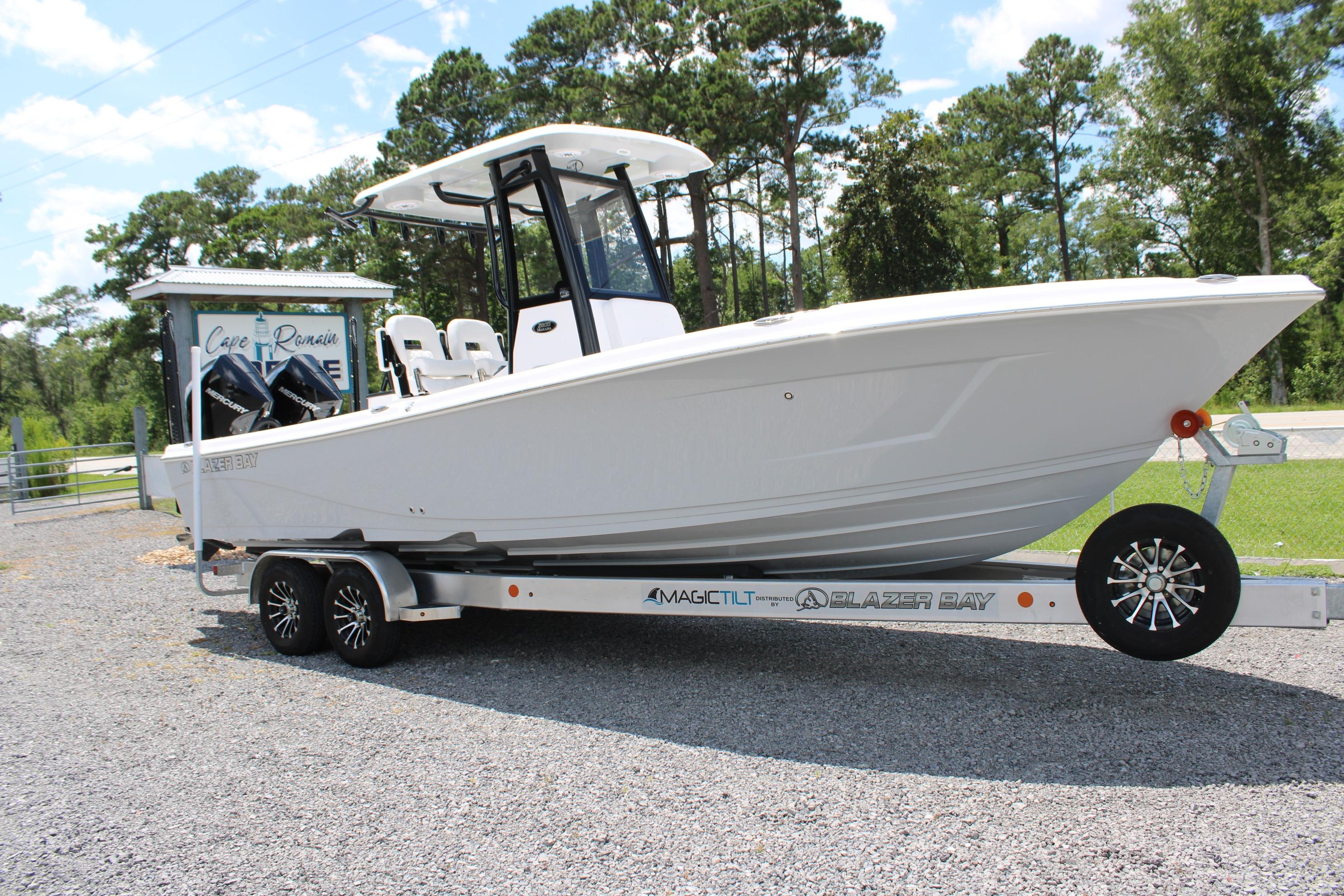 2027 Blazer Bay Makaira 2800 boat on trailer, parked outdoors.