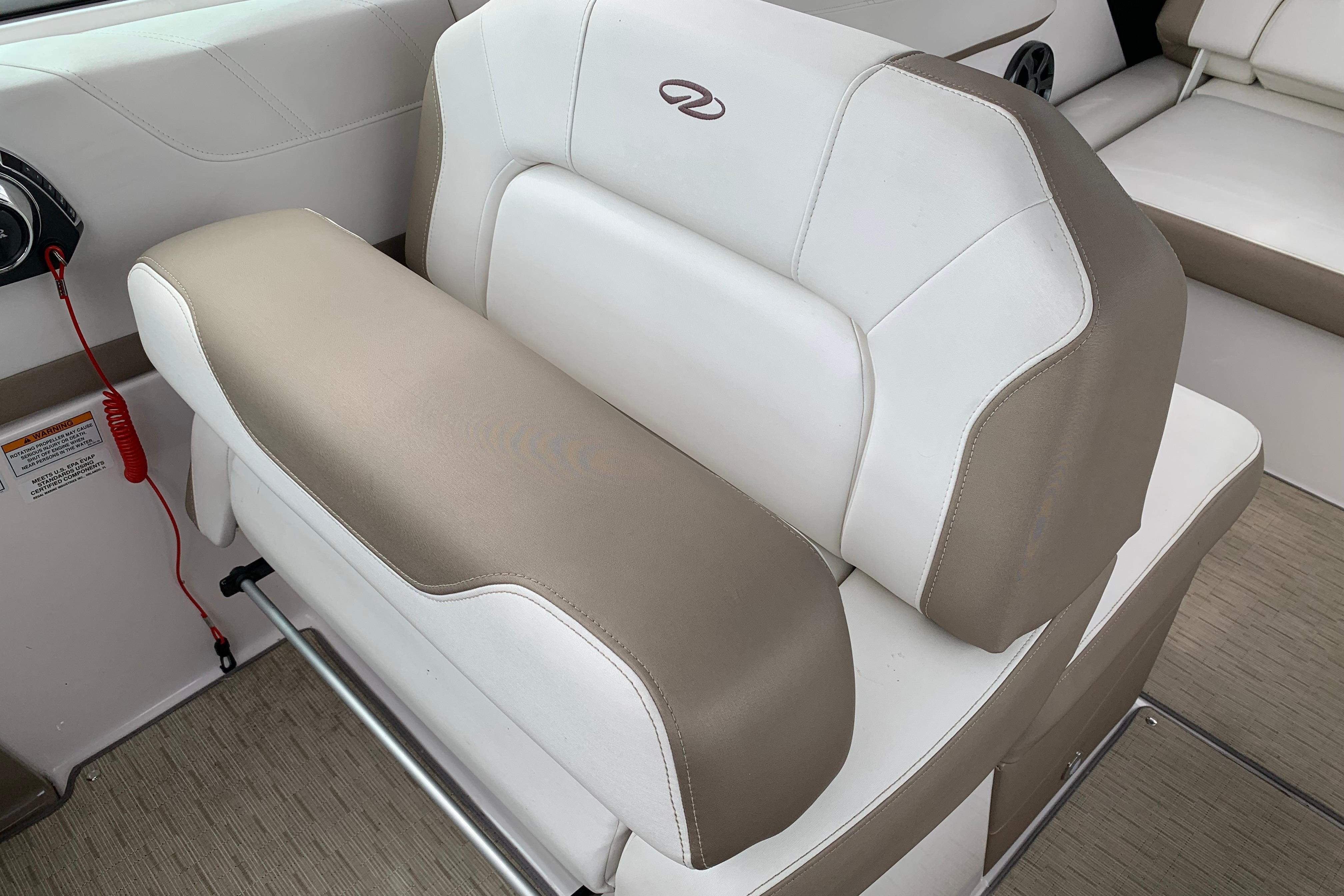 2017 Regal 26 Express boat interior seating with beige and white upholstery.