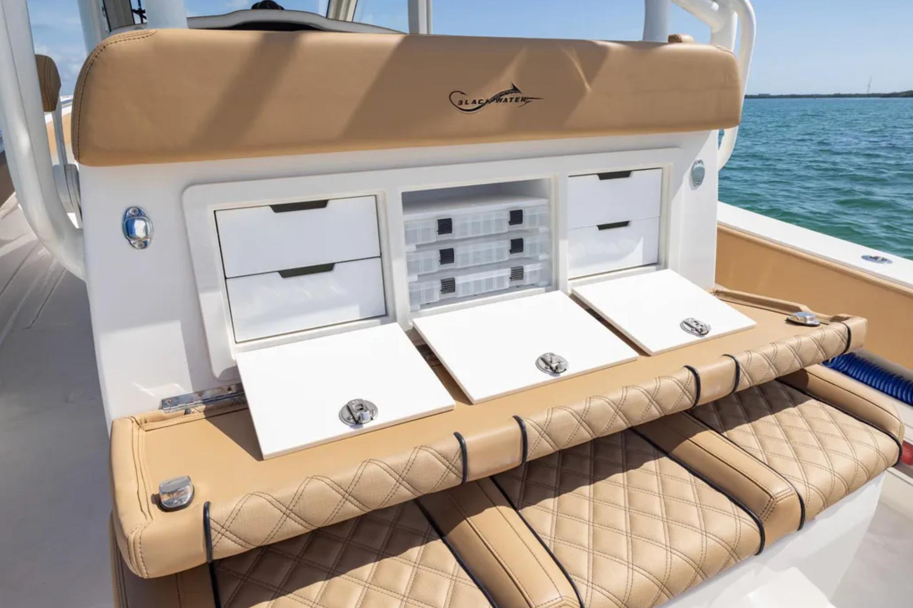 2025 Blackwater 41 Performance Fish boat with tan seating and storage compartments.