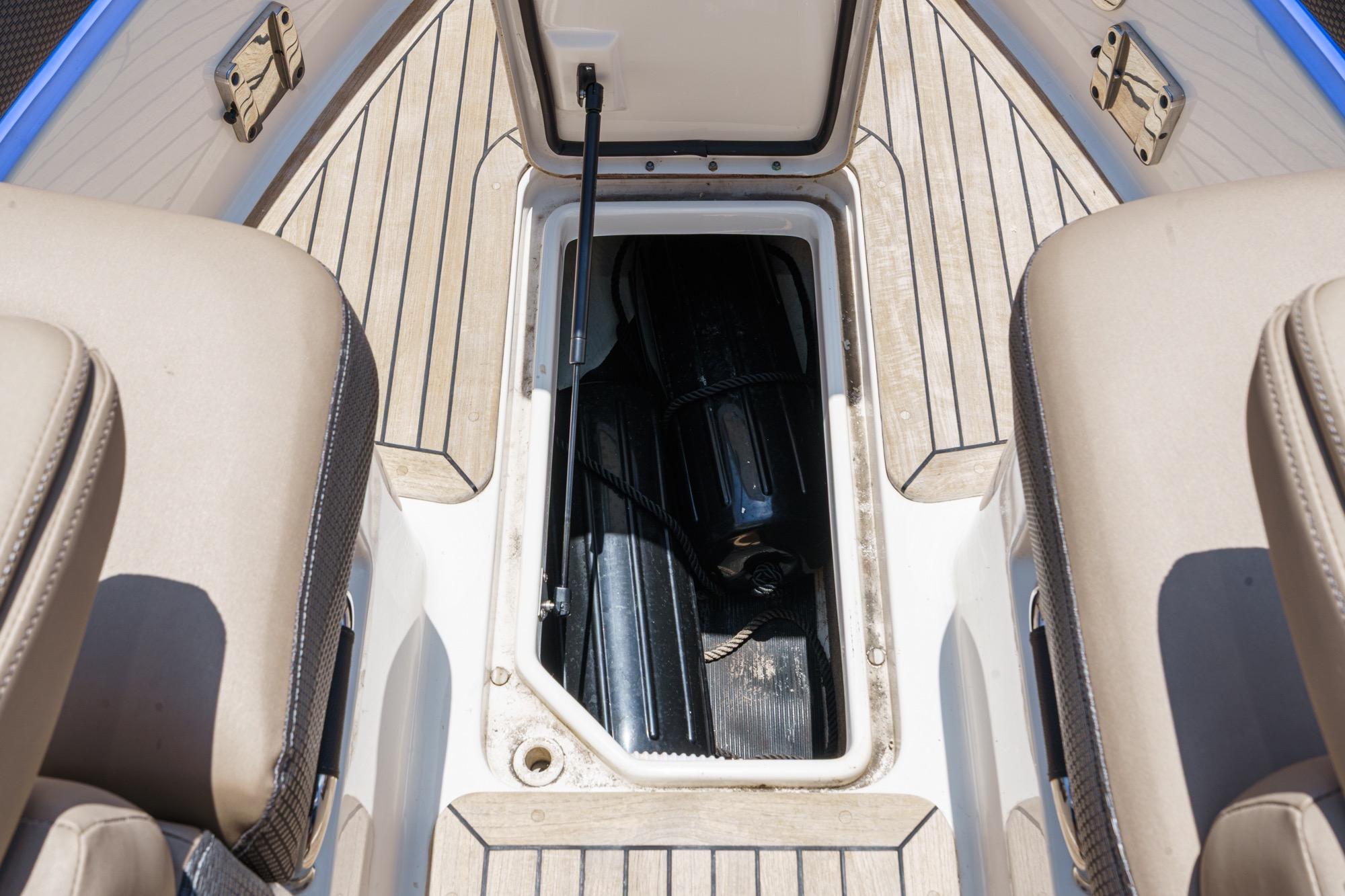 Open storage compartment on 2018 Sea Ray SLX 310 boat deck.
