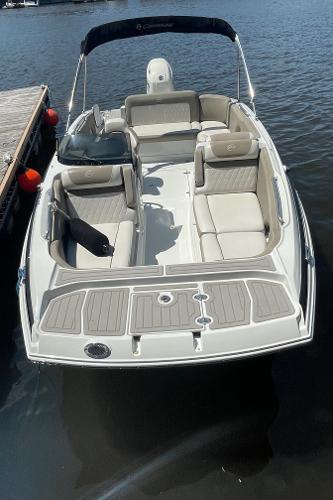2020 Crownline E 205 XS boat with spacious seating on the water.