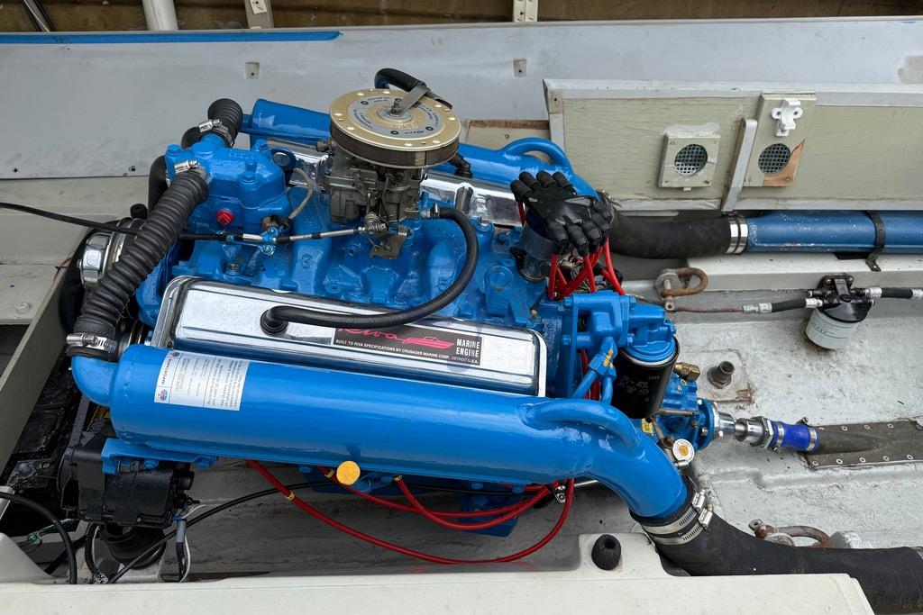 1972 Riva Rudy boat engine, vibrant blue, detailed components, classic marine engineering.