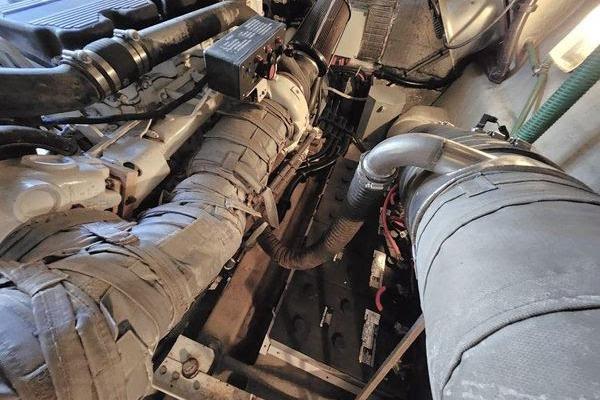 Engine room of a 2005 Sunseeker Manhattan 66 yacht, showcasing mechanical components.