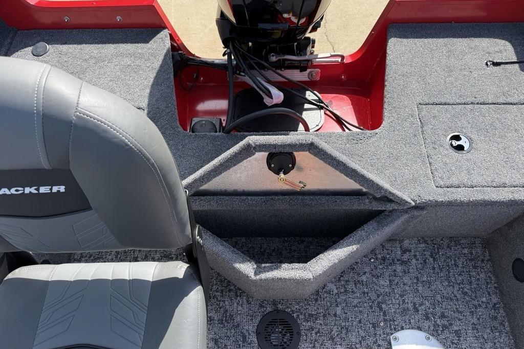 Interior view of a 2026 Tracker Pro Guide V-16 SC boat, featuring seating and motor area.
