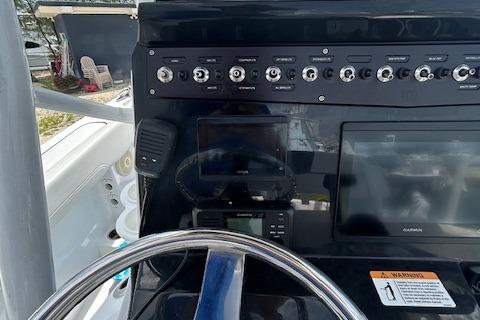 2022 Wellcraft 222 Fisherman dashboard with steering wheel and control panel.