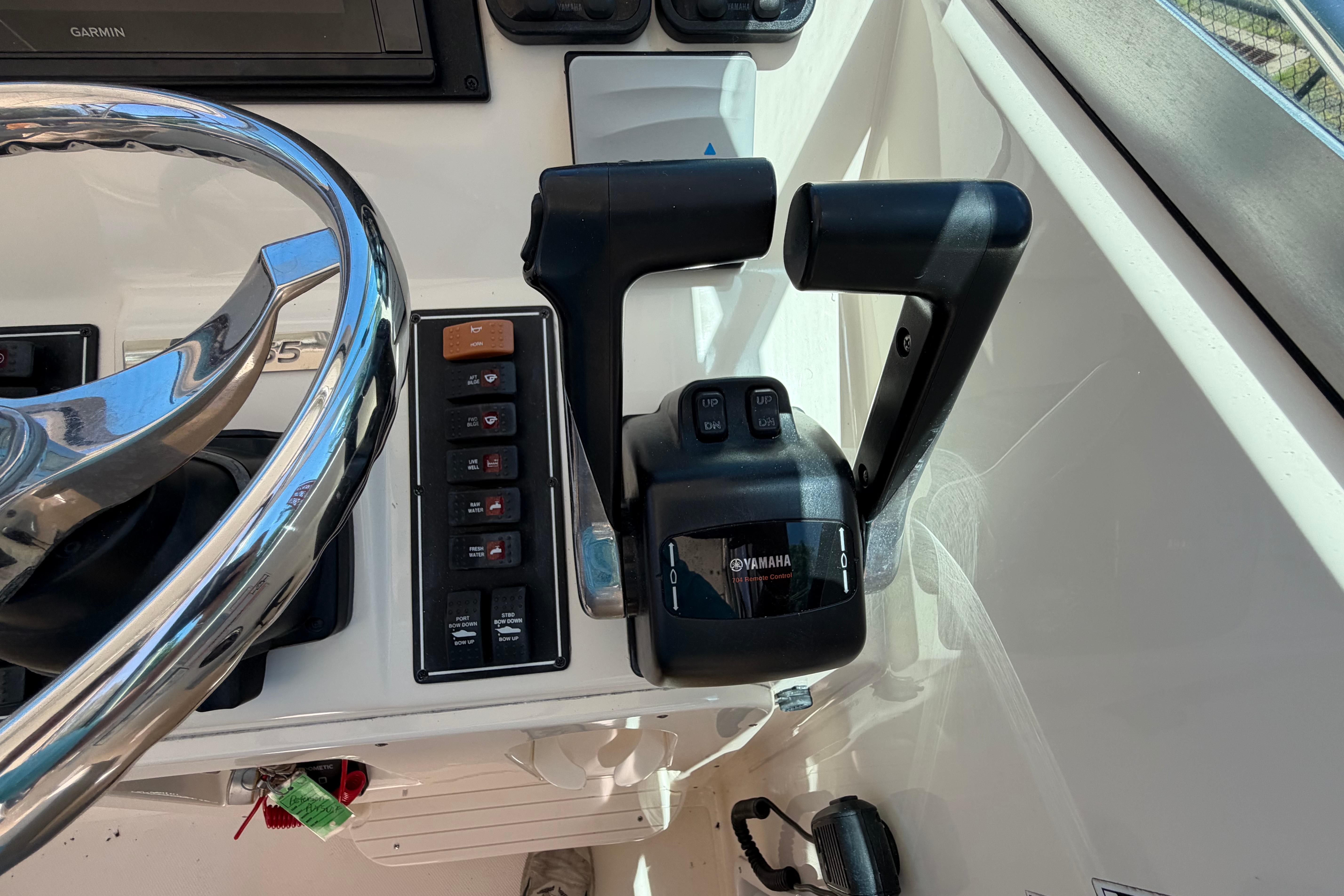 Control panel of a 2010 Pursuit OS 255 Offshore boat with Yamaha throttle.