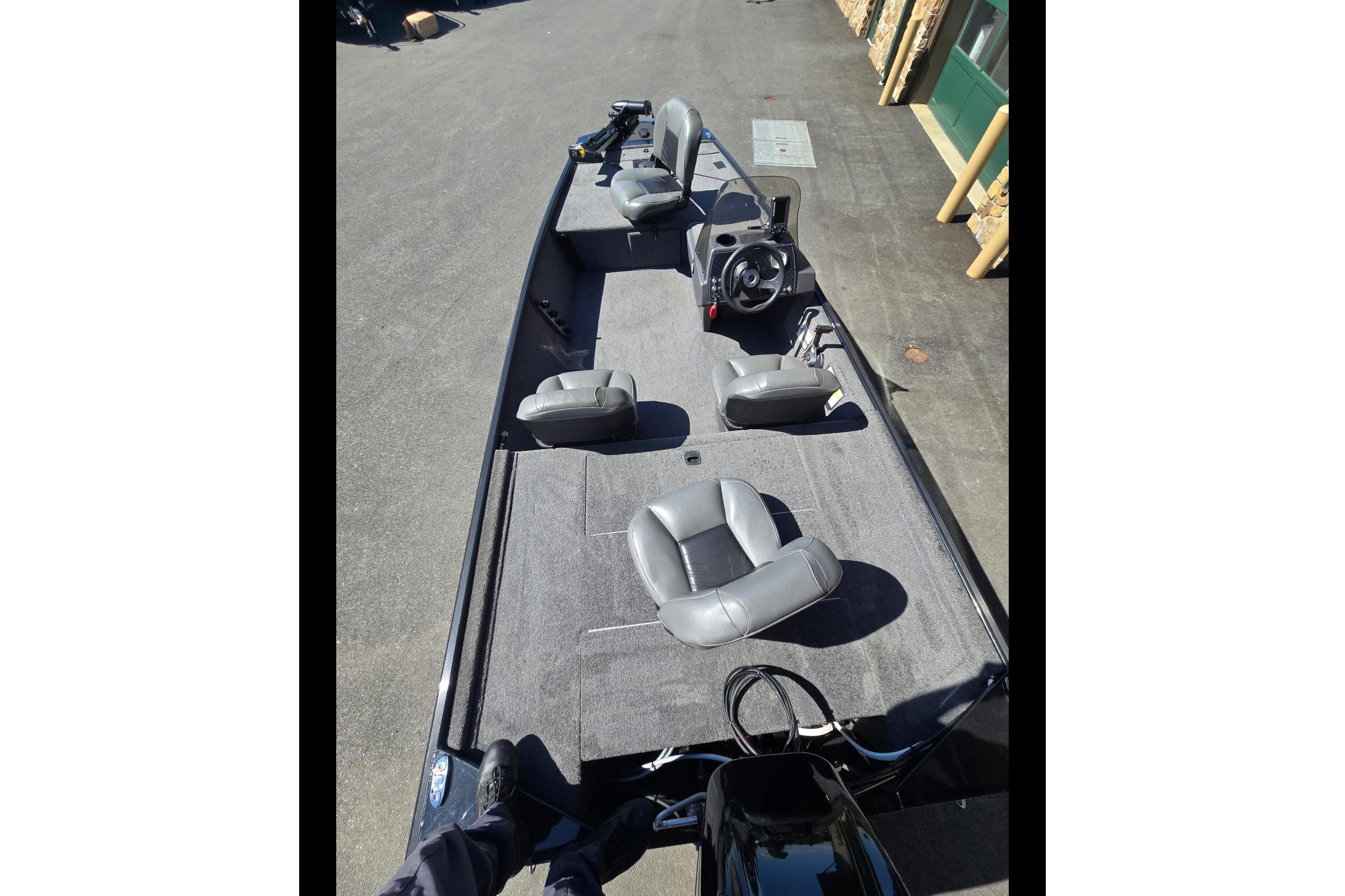 2024 Tracker Bass Tracker Classic XL boat with gray seating and steering console.