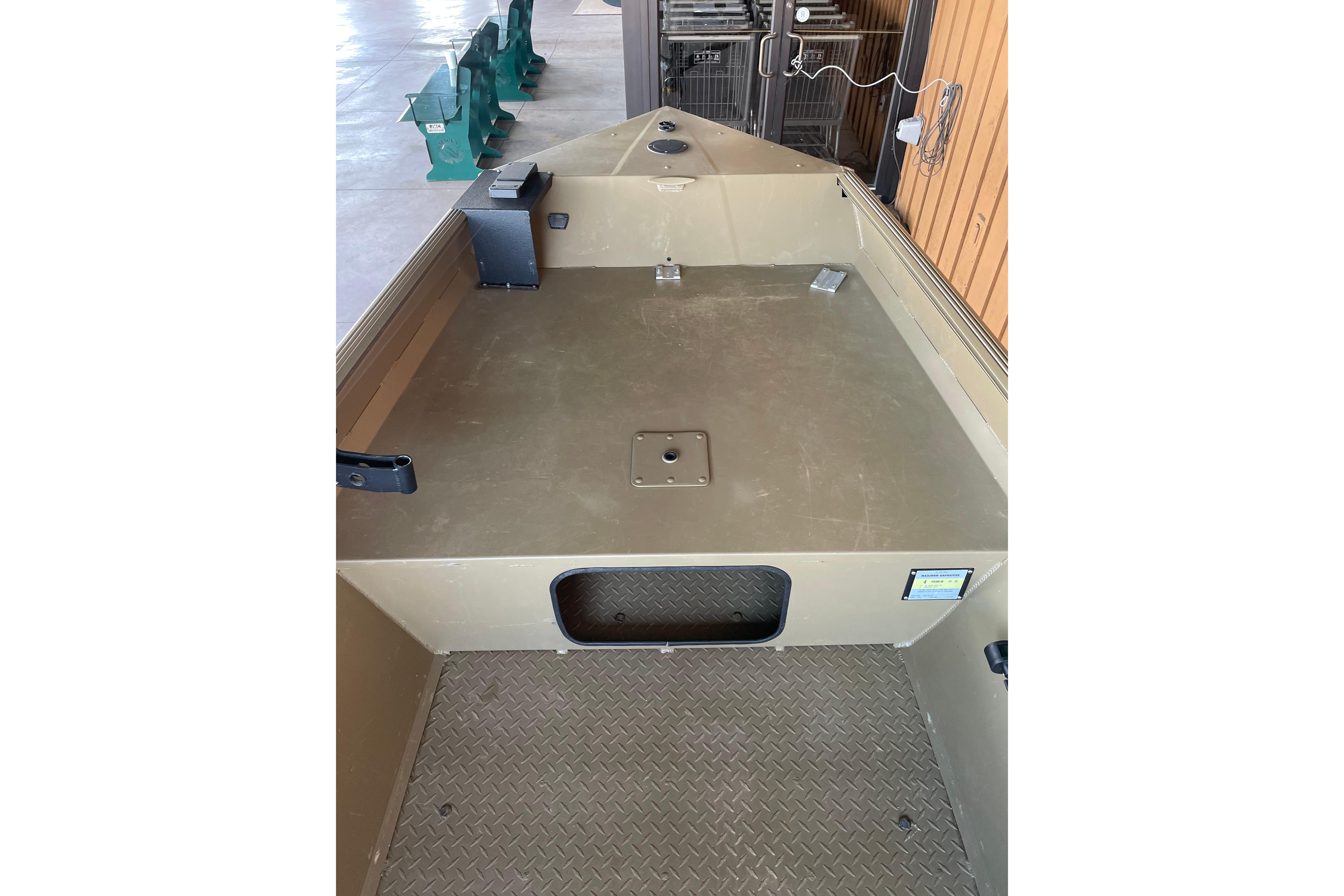 2025 Edge Duck Boats 550 interior with spacious deck and storage compartment.