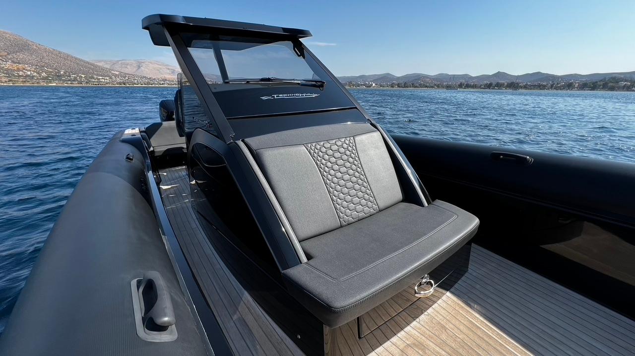 2023 Technohull EXPLORER 40S luxury boat on calm water, featuring sleek design and comfortable seating.