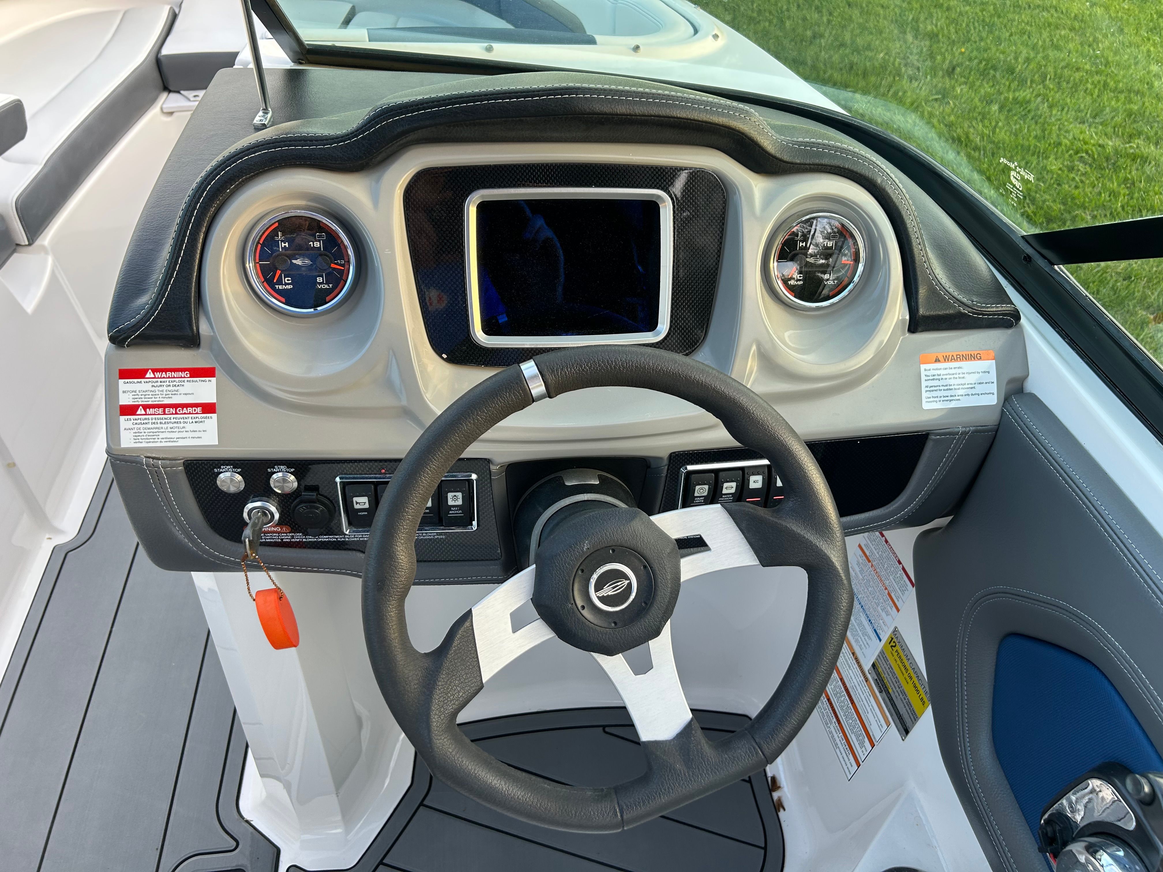 2015 Chaparral Vortex 243 VRX helm with steering wheel and gauges.