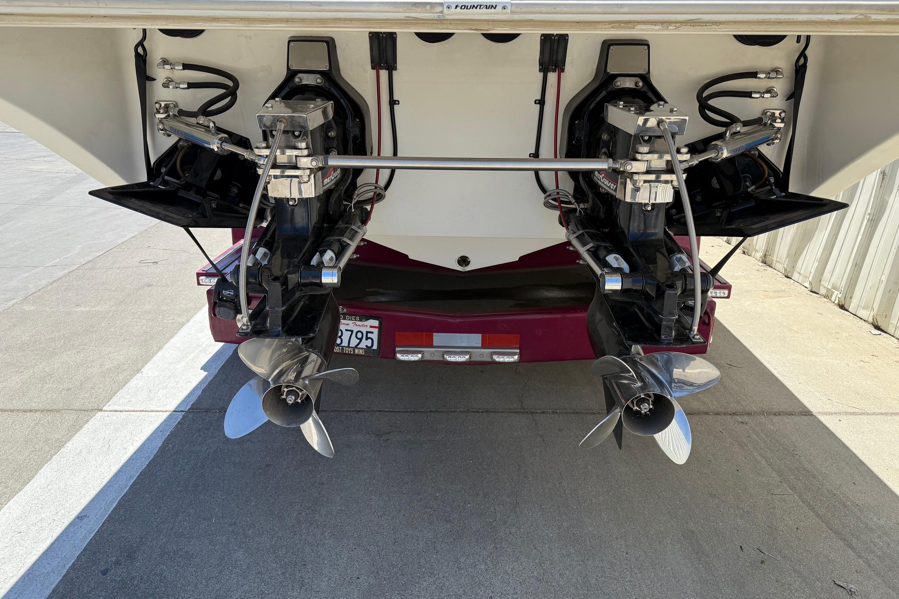 Rear view of a 1998 Fountain 35 Lightning boat with dual propellers.