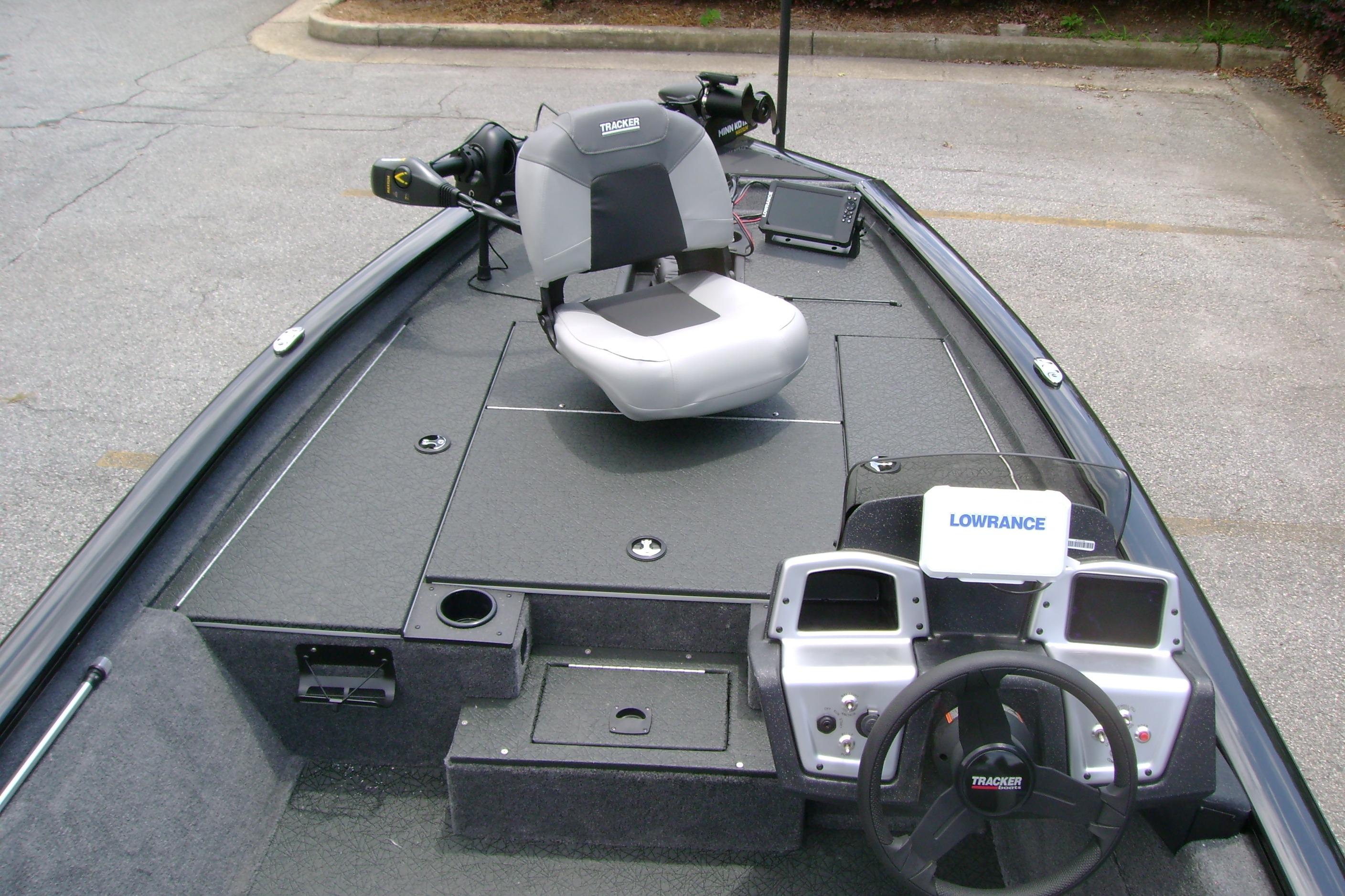 2026 Tracker Pro Team 175 boat interior with steering console and fishing seat.