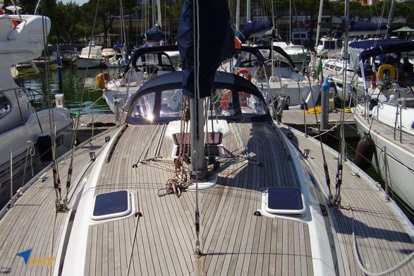 2003 Grand Soleil 46.3 sailboat docked in a marina, showcasing its deck and rigging.