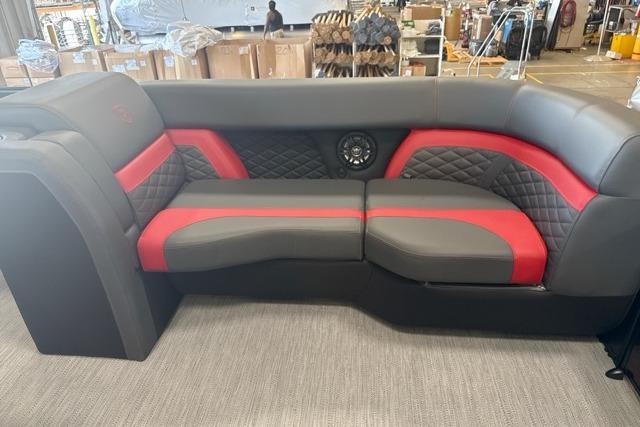 Luxurious seating on 2027 Godfrey Monaco 25' Tritoon, featuring stylish red and gray upholstery.