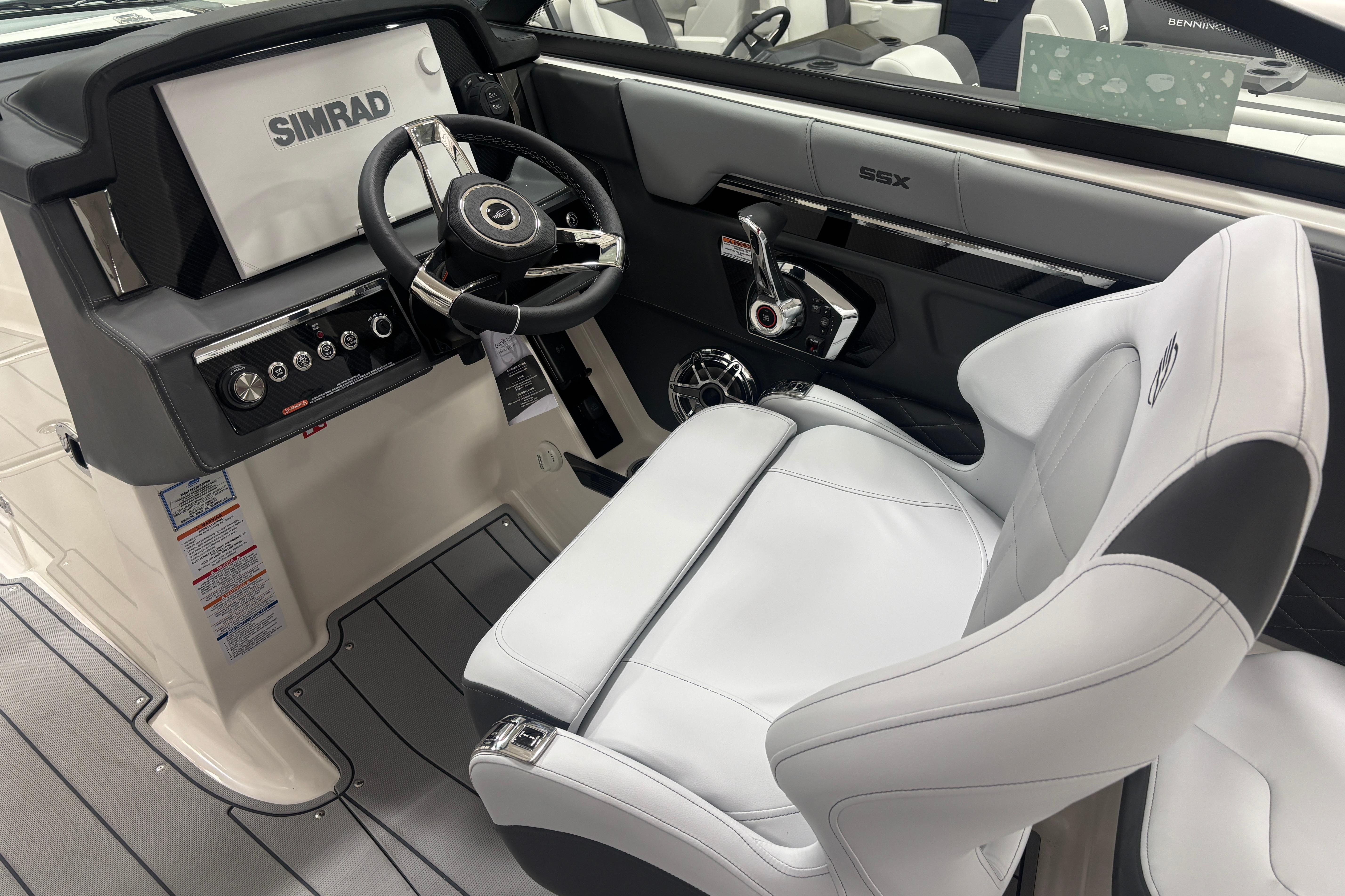 2026 Chaparral SSX 30 boat interior with Simrad display and luxurious white seating.