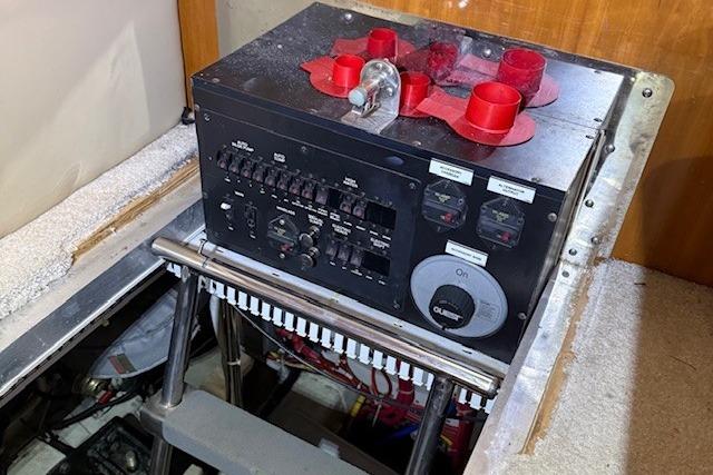Electrical panel inside a 2006 Carver 466 Motor Yacht, featuring switches and gauges.