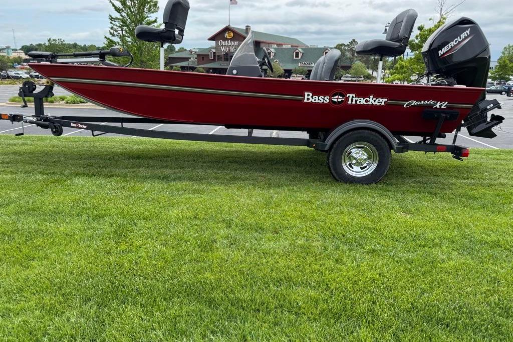 2026 Tracker Bass Tracker Classic XL boat on trailer, parked on grass.