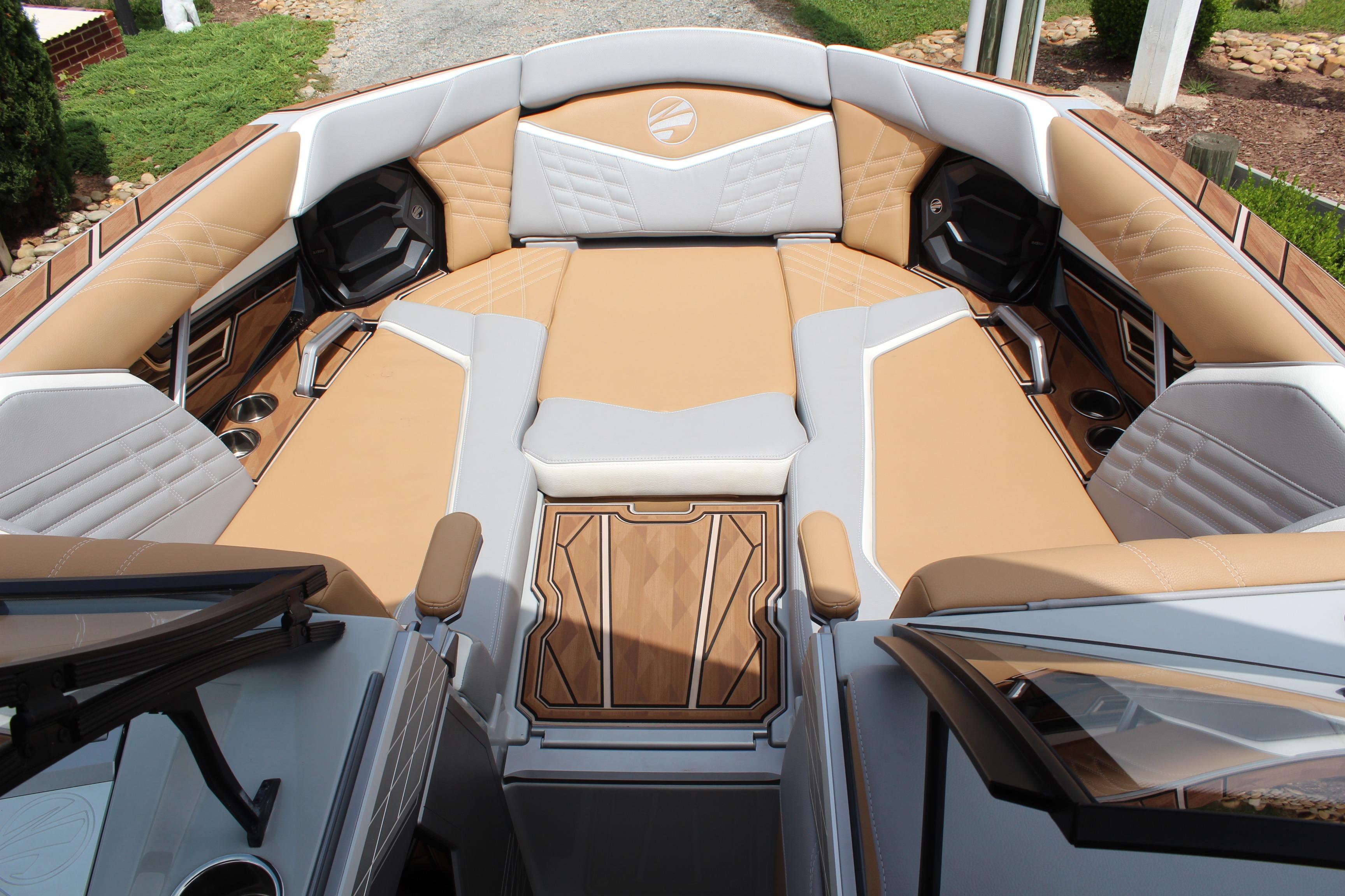 Luxurious interior of 2024 Tigé Ultré 25ZX boat with tan and gray seating.