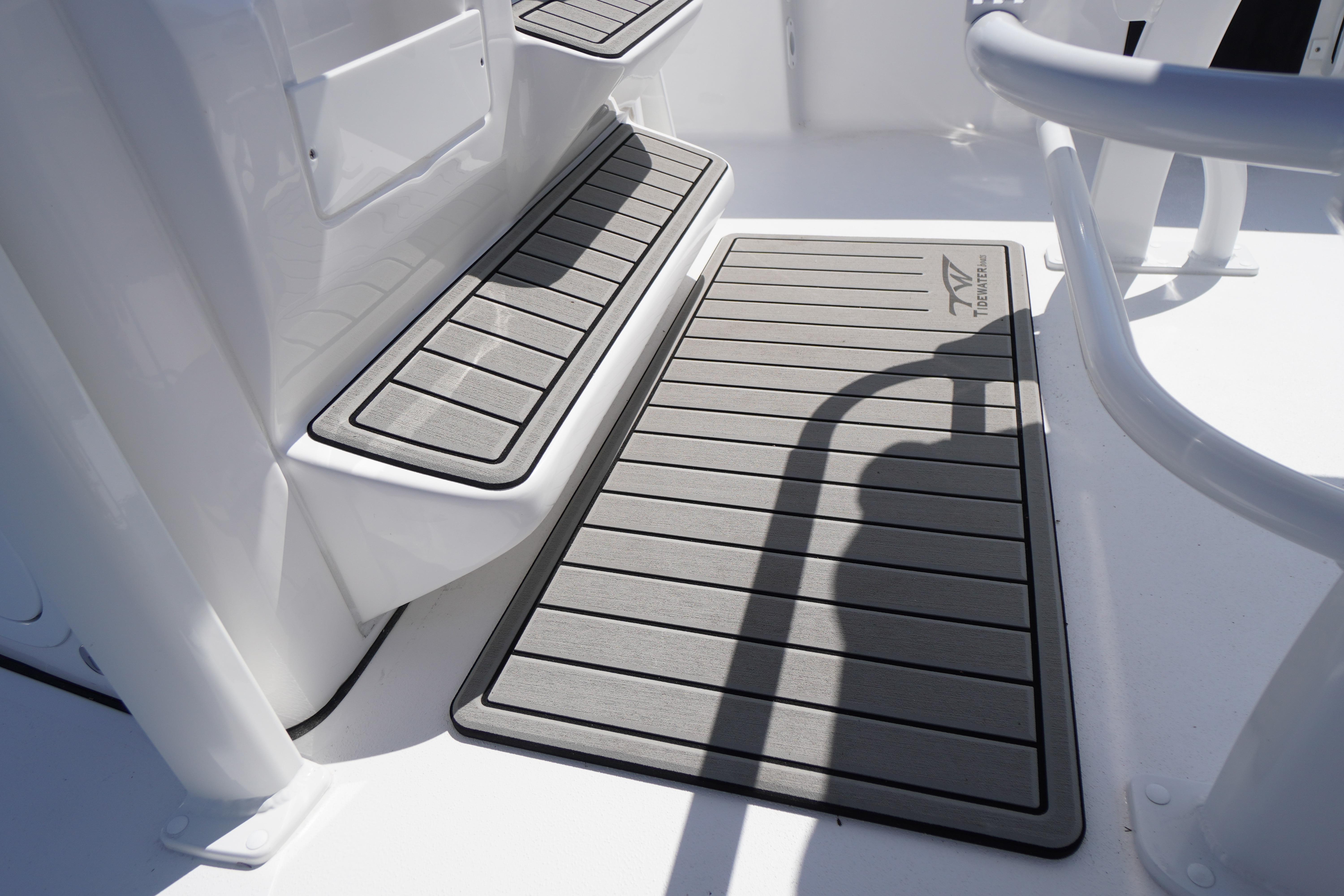 2026 Tidewater 220 CC Adventure boat deck with non-slip flooring and seating area.