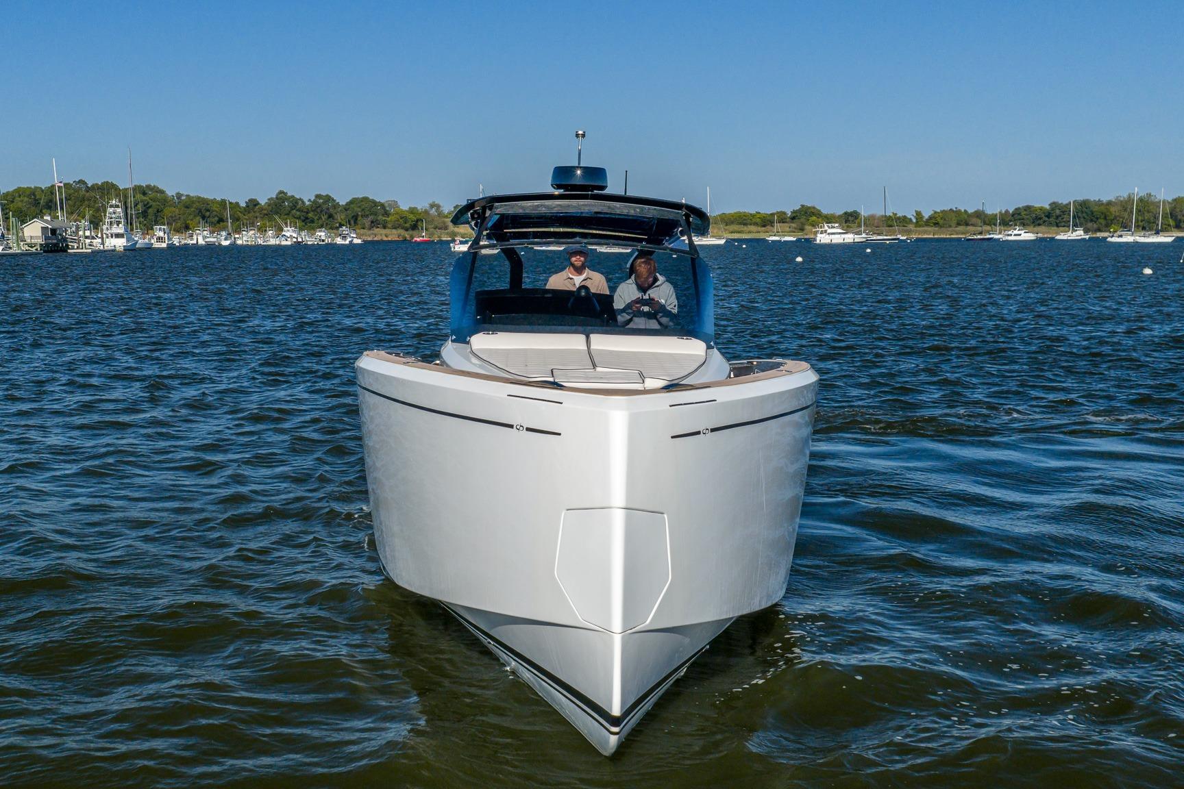 2025 Pardo Yachts 38 cruising on a serene lake under clear blue skies.