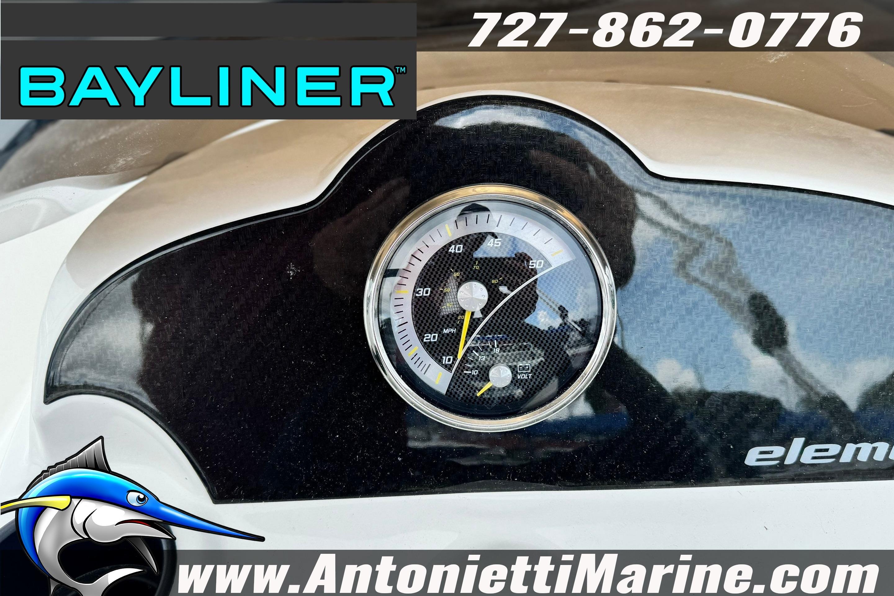Bayliner Element E16 dashboard with gauge, logo, and contact details.