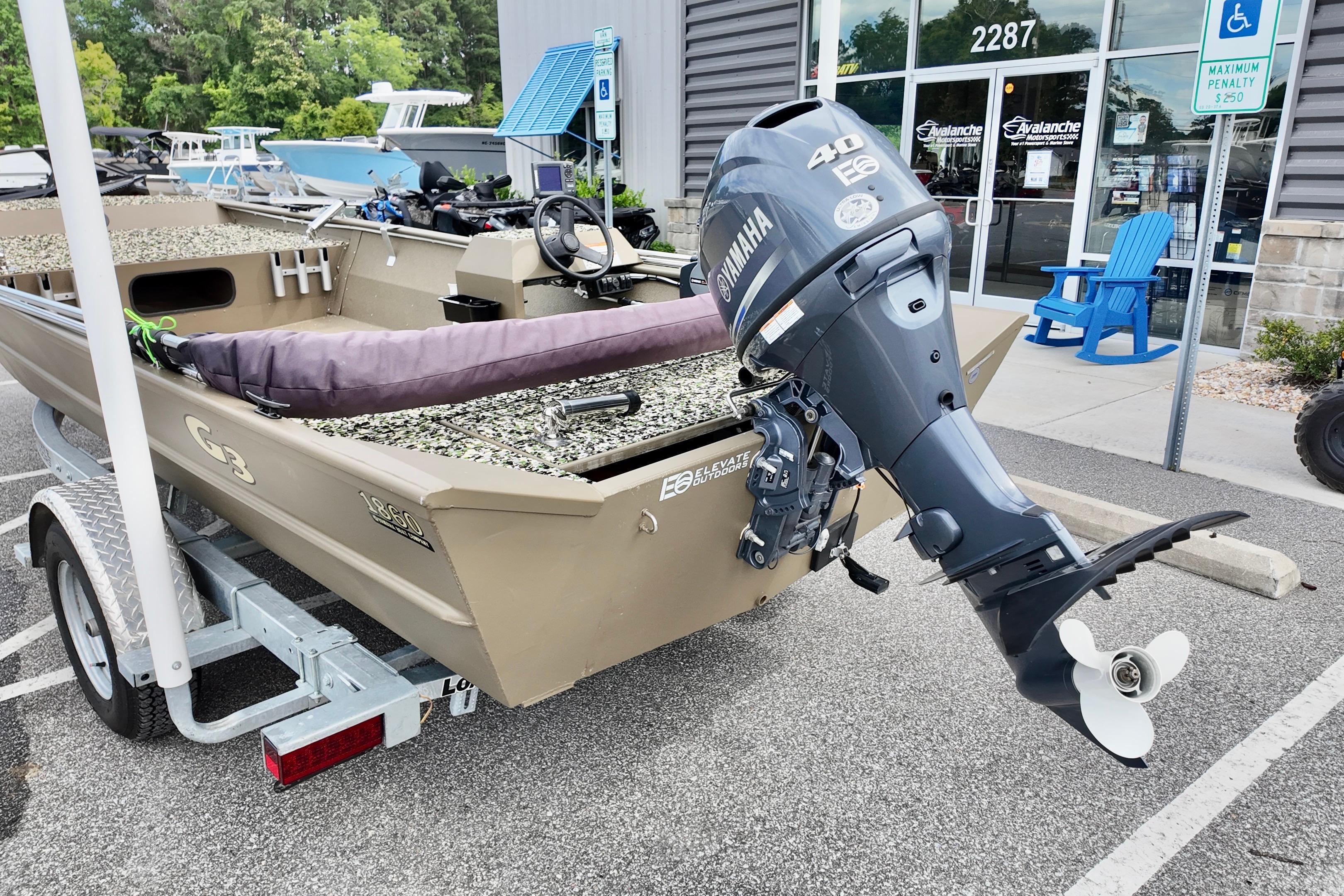 2025 G3 BOATS 1860 SC with Yamaha motor, parked outside dealership.