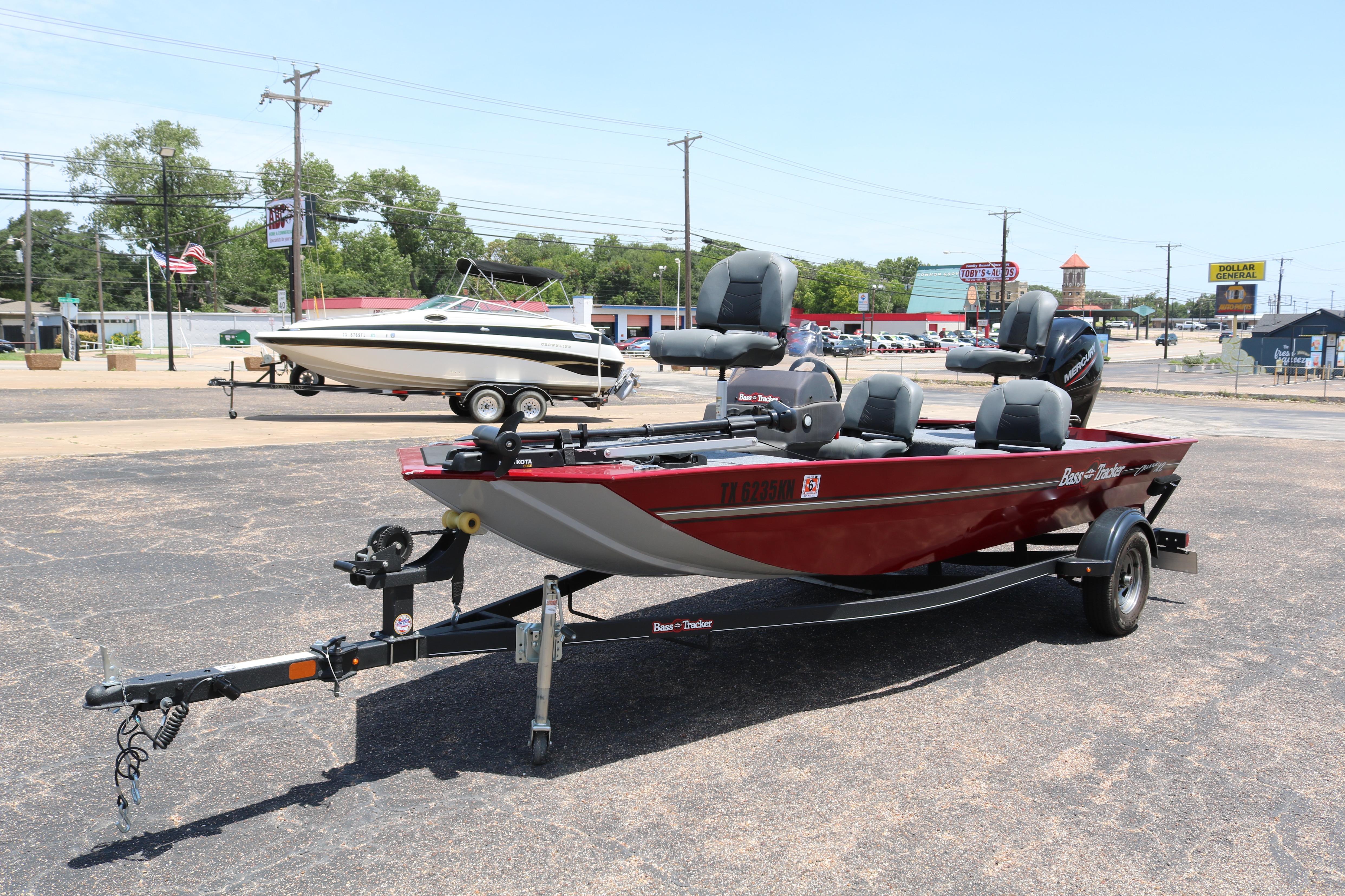 2021 Tracker Bass Tracker Classic XL boat on trailer in parking lot.