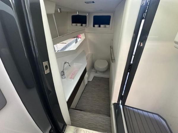 2022 Cobalt A36BR boat interior bathroom with sink, toilet, and modern design.