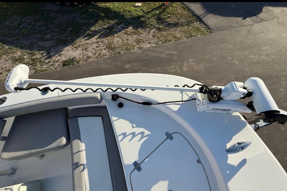 2023 Falcon Boats F22 with Minn Kota trolling motor on deck.