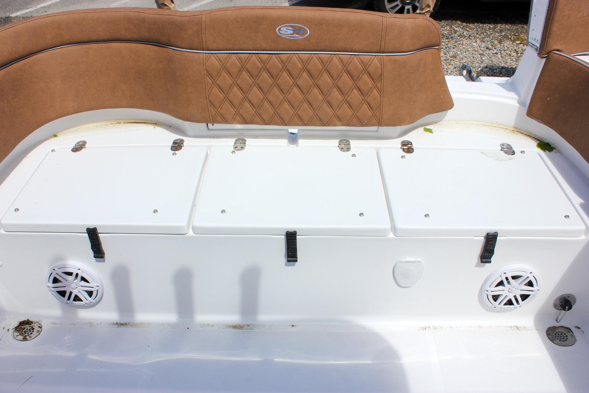 2027 Sea Hunt Ultra 234 boat interior with cushioned seating and storage compartments.