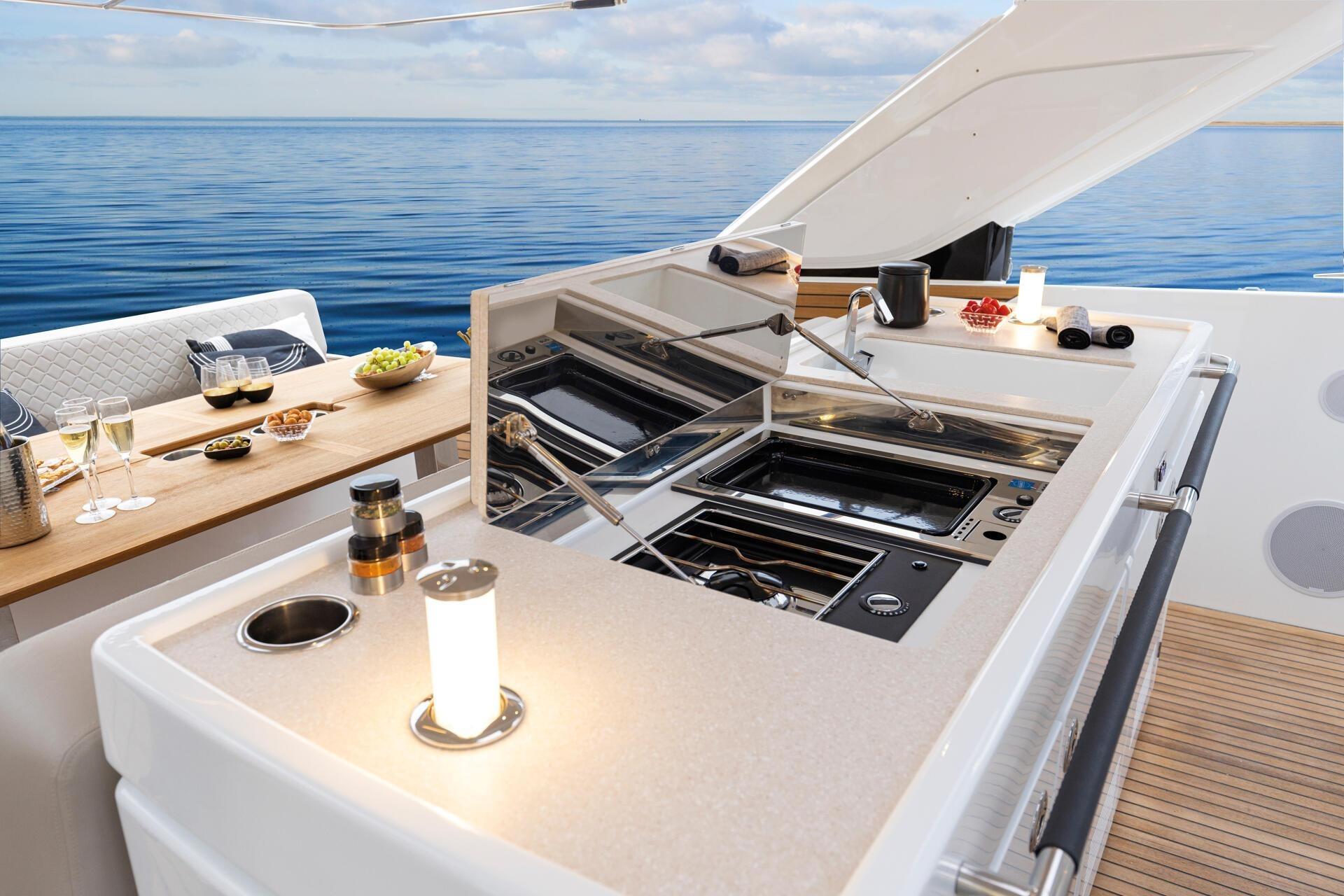 Outdoor kitchen on 2027 Jeanneau DB/43 OB yacht with ocean view.