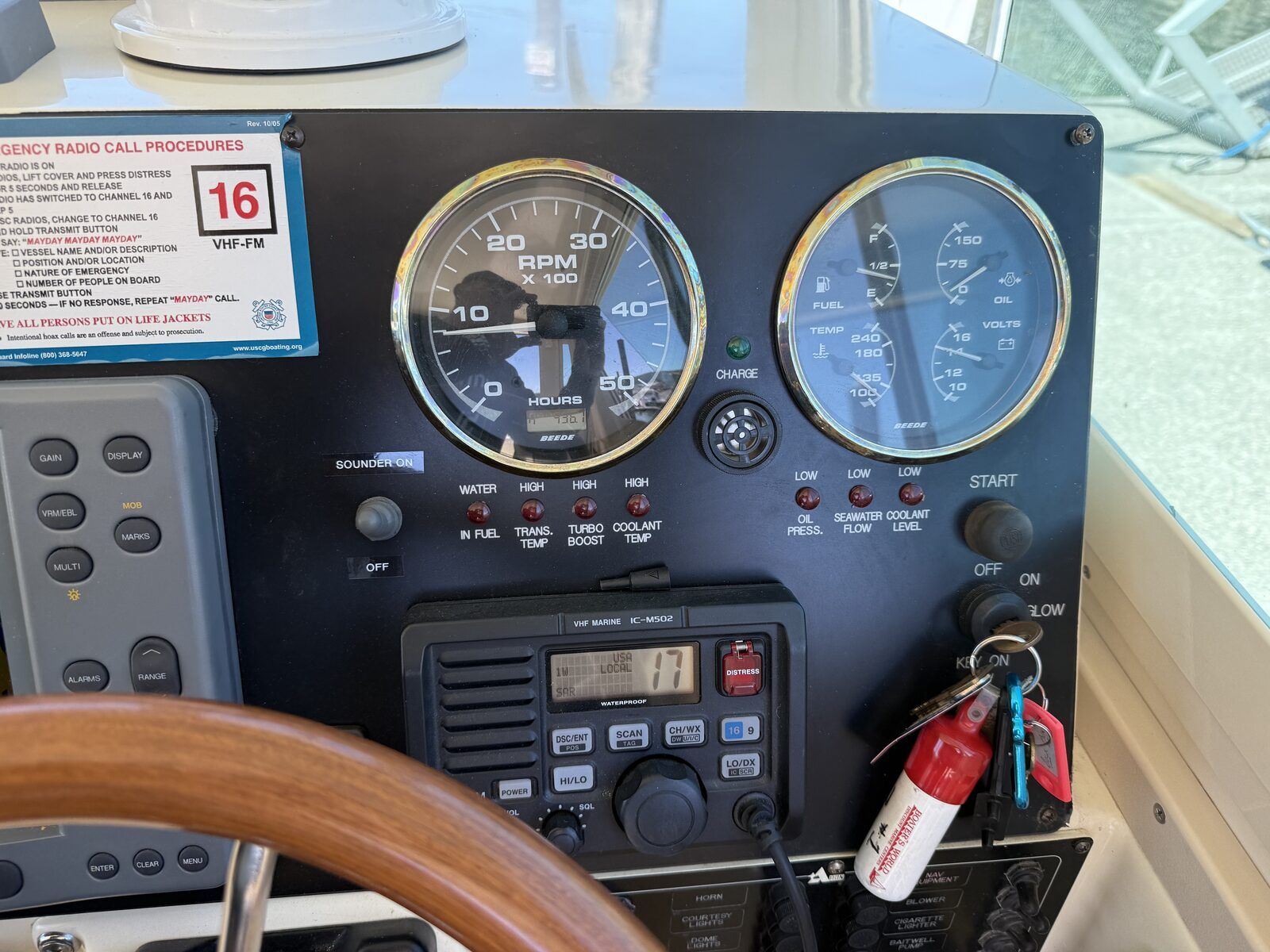 Boat dashboard with gauges and controls.