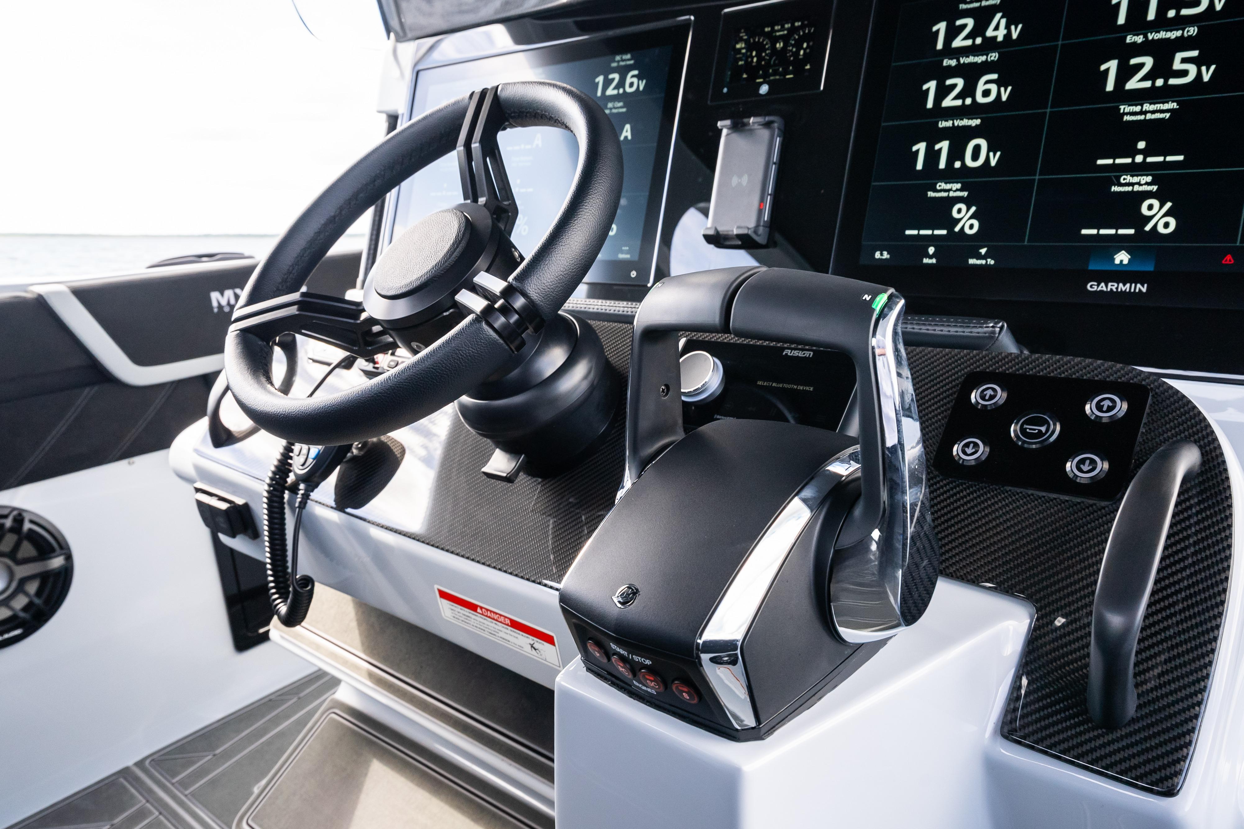 2027 Mystic Powerboats M4200 helm with advanced controls and digital displays.