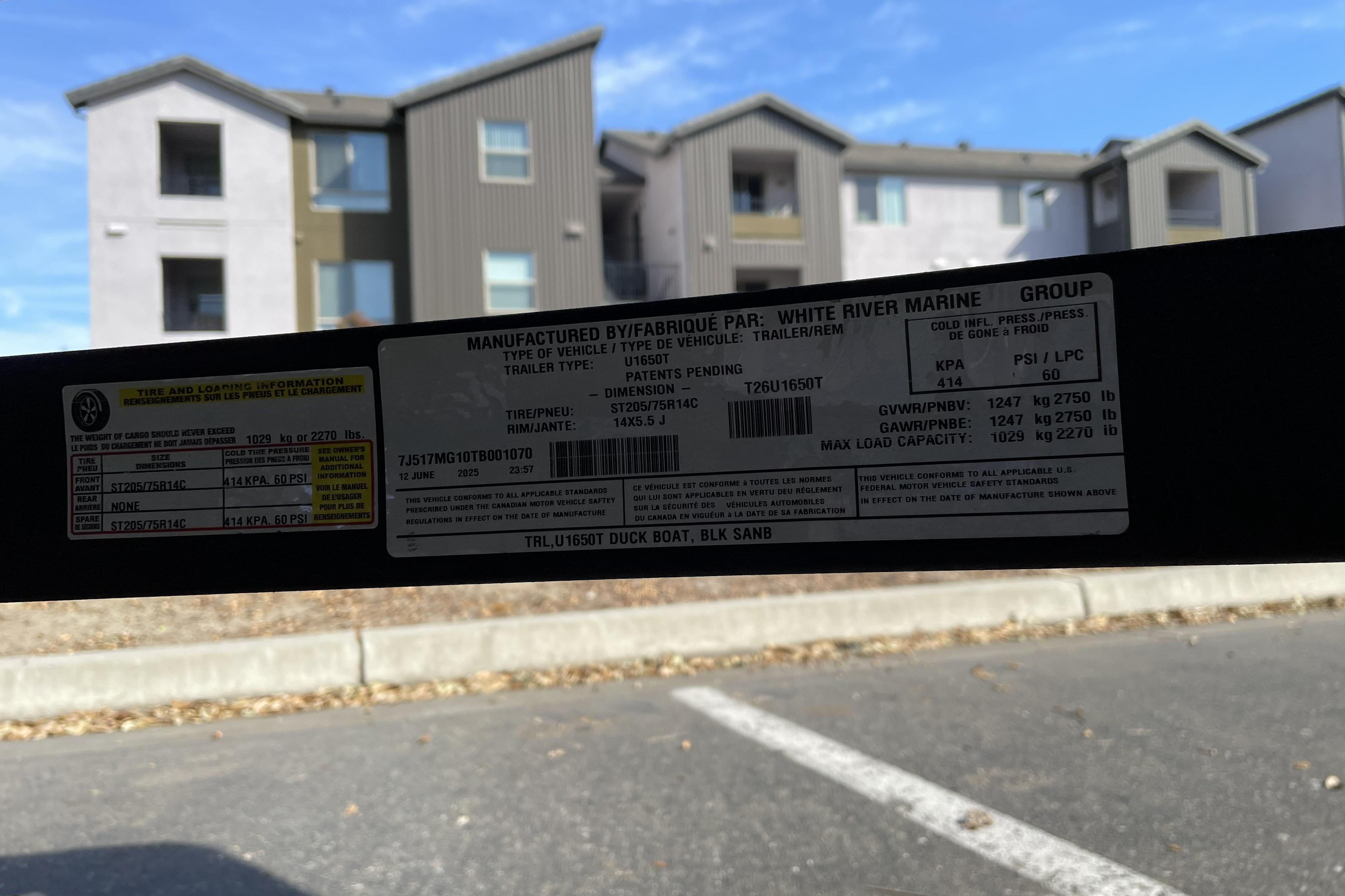 Sticker on 2026 Tracker Grizzly 1650 T Prairie Wings Edition trailer, showing specifications and load capacity.