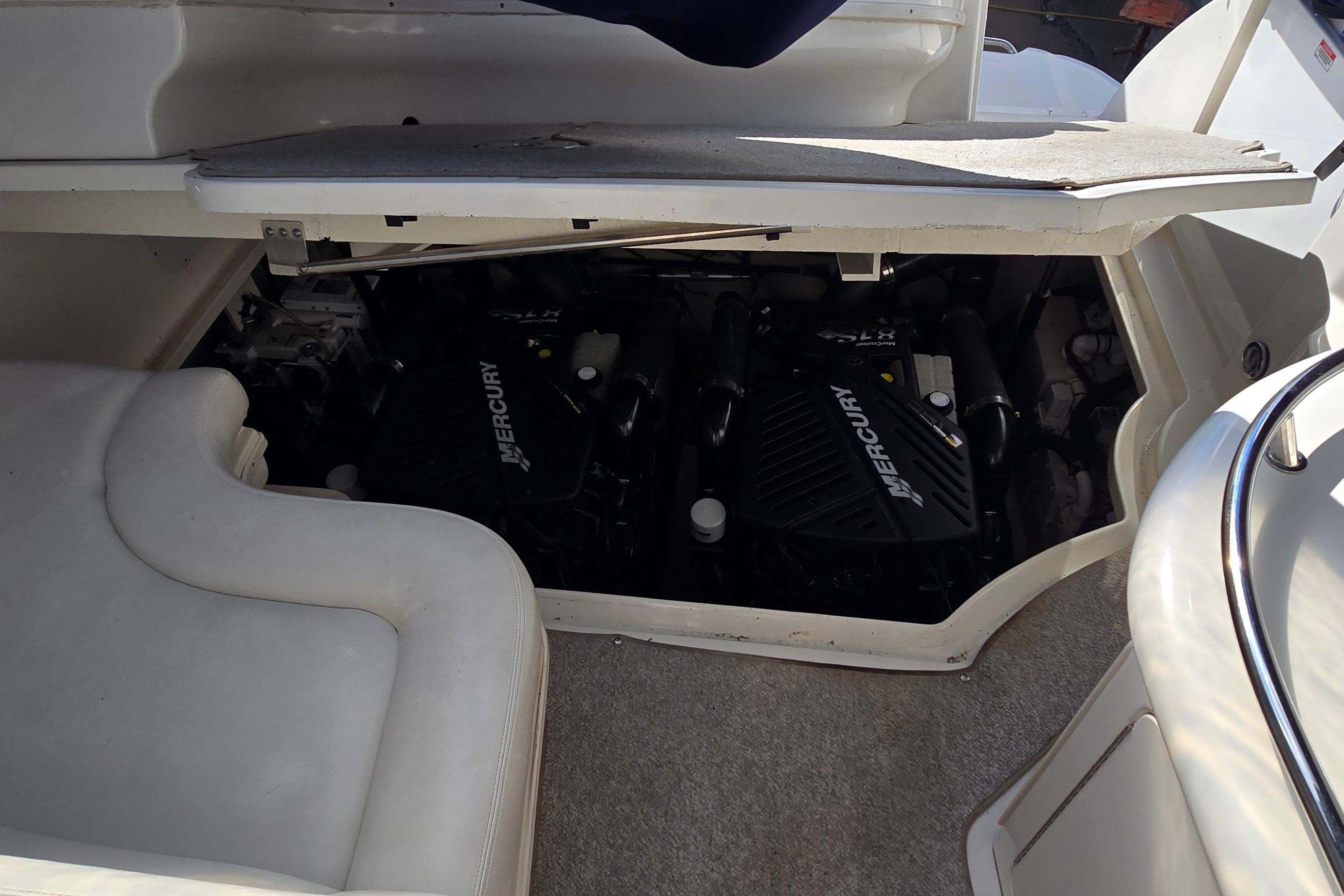 Engine compartment of a 2007 Sea Ray 340 Sundancer with Mercury engines visible.