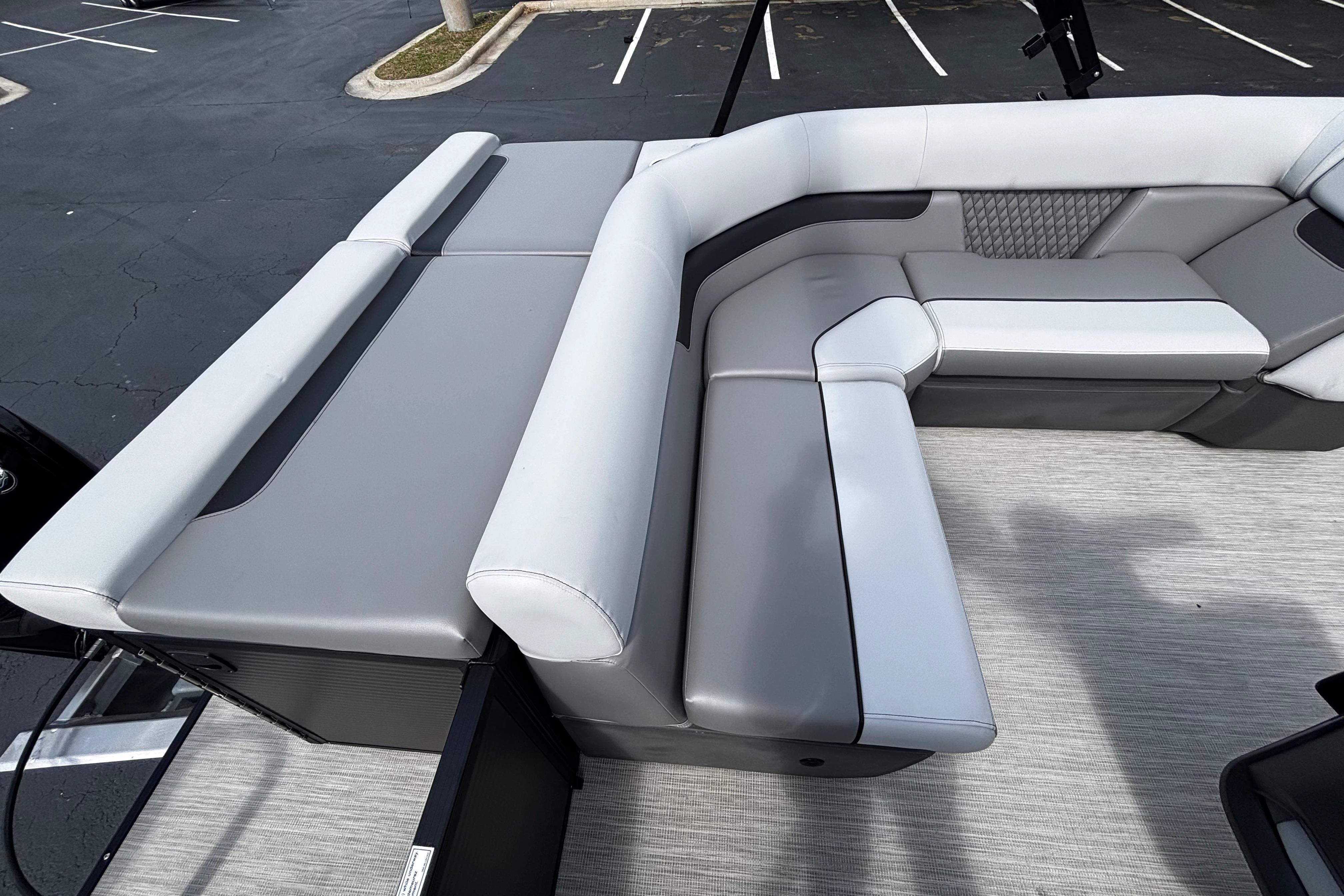 2026 Princecraft Sportfisher 21-2S boat interior with gray cushioned seating.