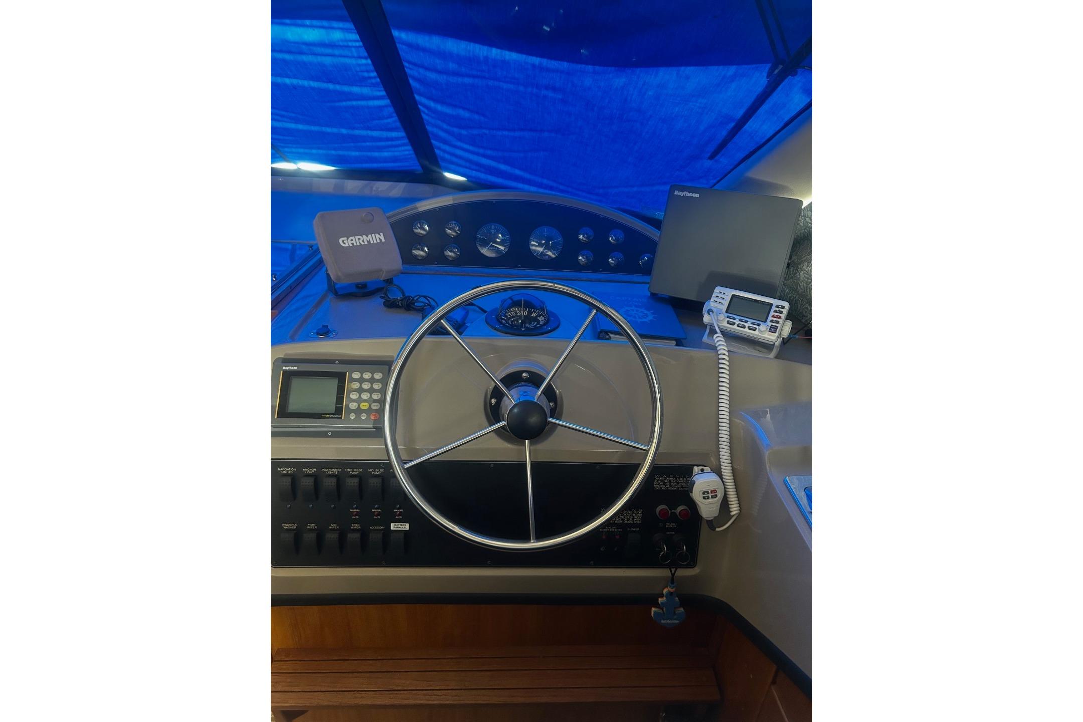 1998 Bayliner 3988 Command Bridge Motoryacht helm with Garmin navigation and communication equipment.