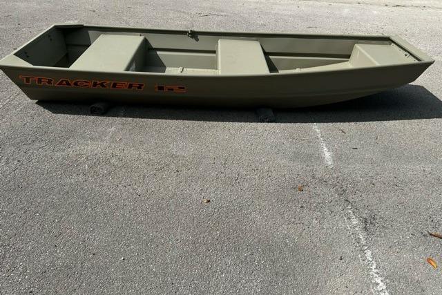 2026 Tracker Grizzly 12 Jon boat on pavement, showcasing its sturdy design.