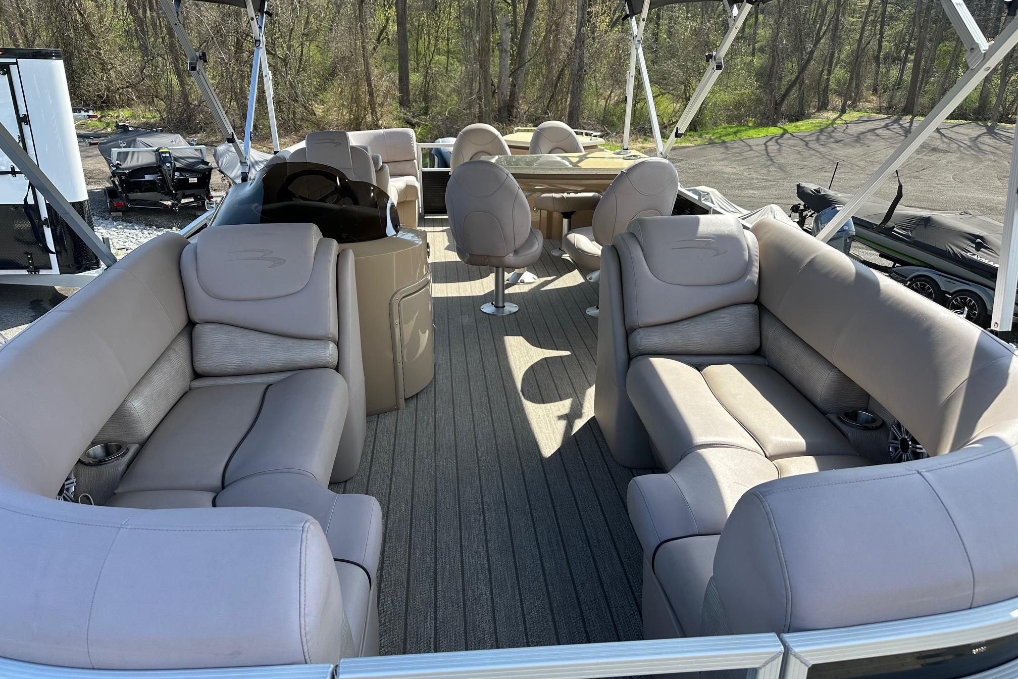 2017 Bennington 22 GPD pontoon boat with spacious seating and modern interior design.