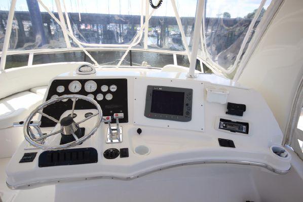 Silverton 42 Convertible 2001 helm with instruments and steering wheel.