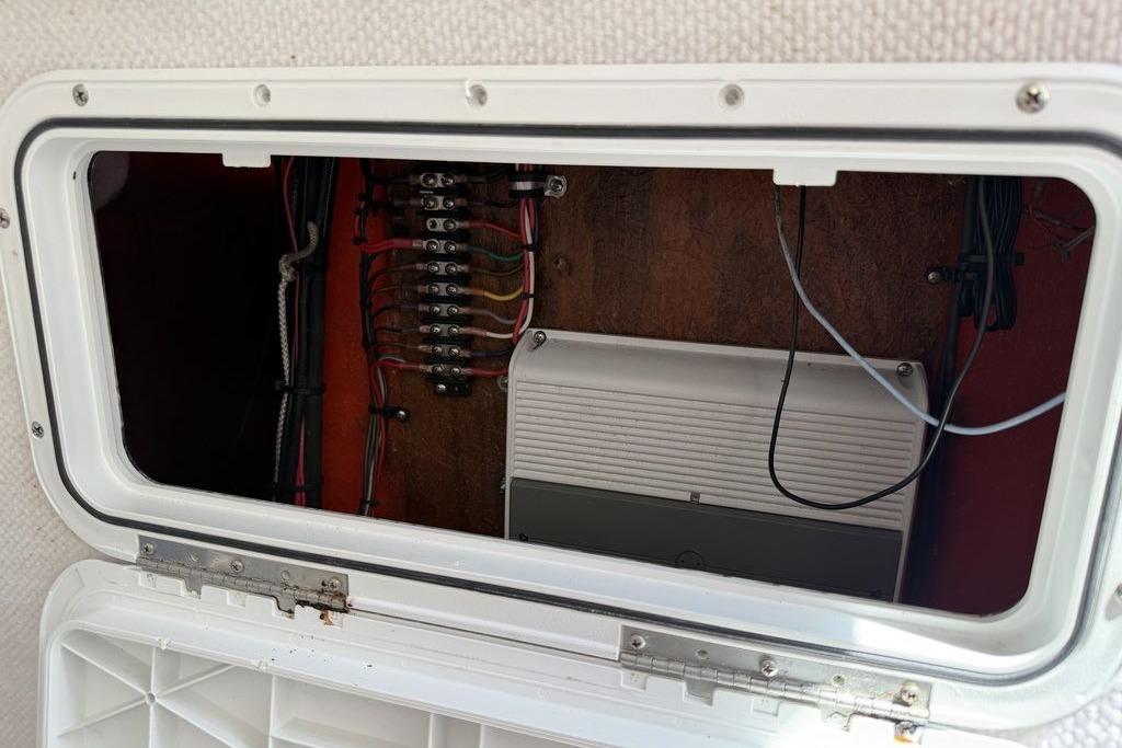 Electrical panel inside a 2003 Sea Hunt Victory 215 boat, showcasing wiring and components.