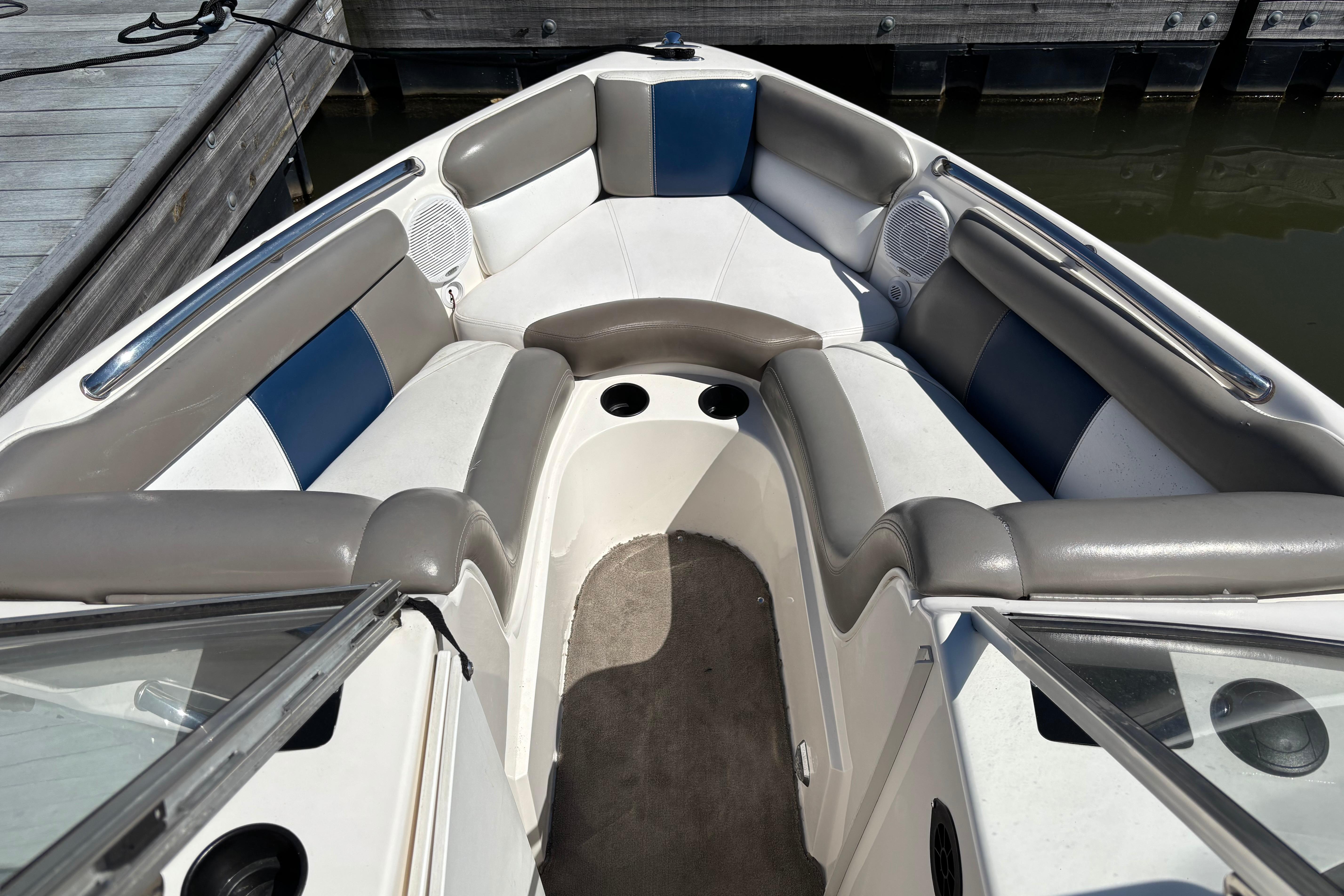 2004 Tigé 22V Limited Edition boat interior with cushioned seating and speakers.
