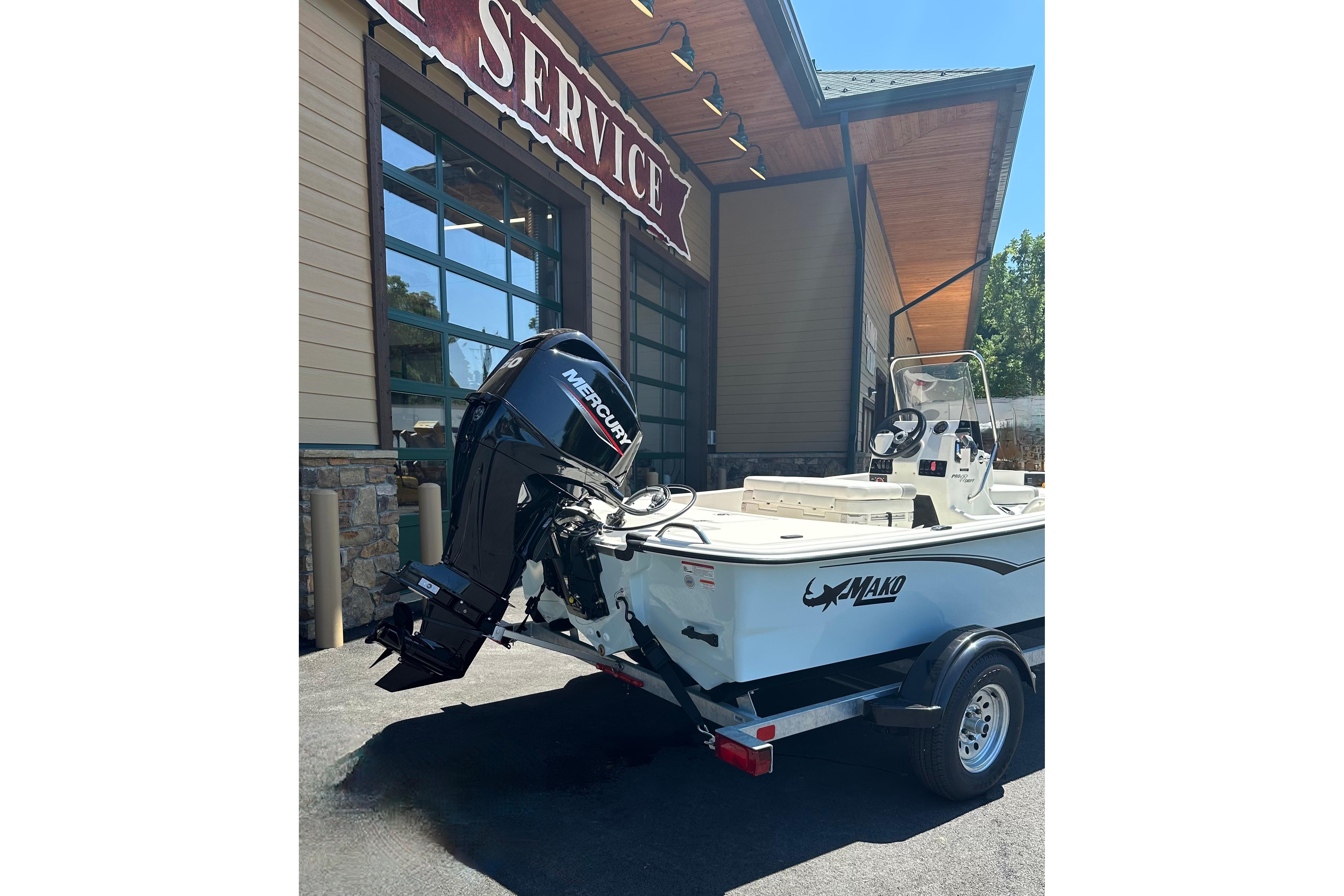 2026 Mako Pro Skiff 17 CC boat with Mercury engine outside service center.